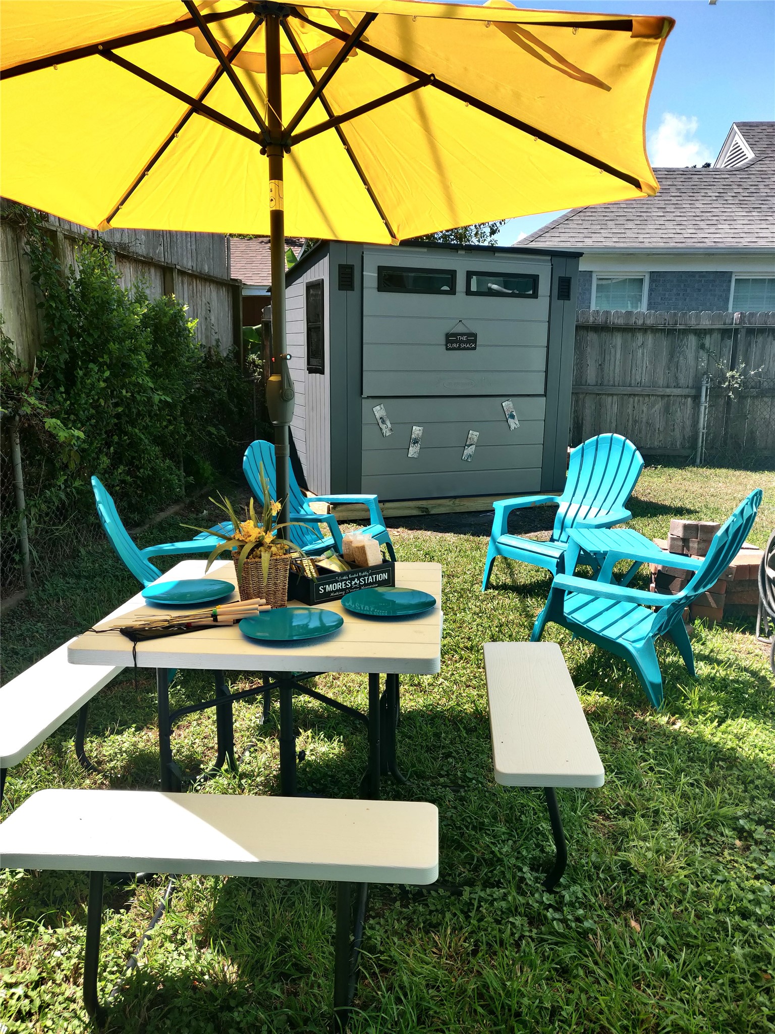 What a great place to spend the evenings - outdoor dining, a firepit for making smores with party lights overhead, or open the front of the Surf Shack to enjoy the bar and the big-screen TV