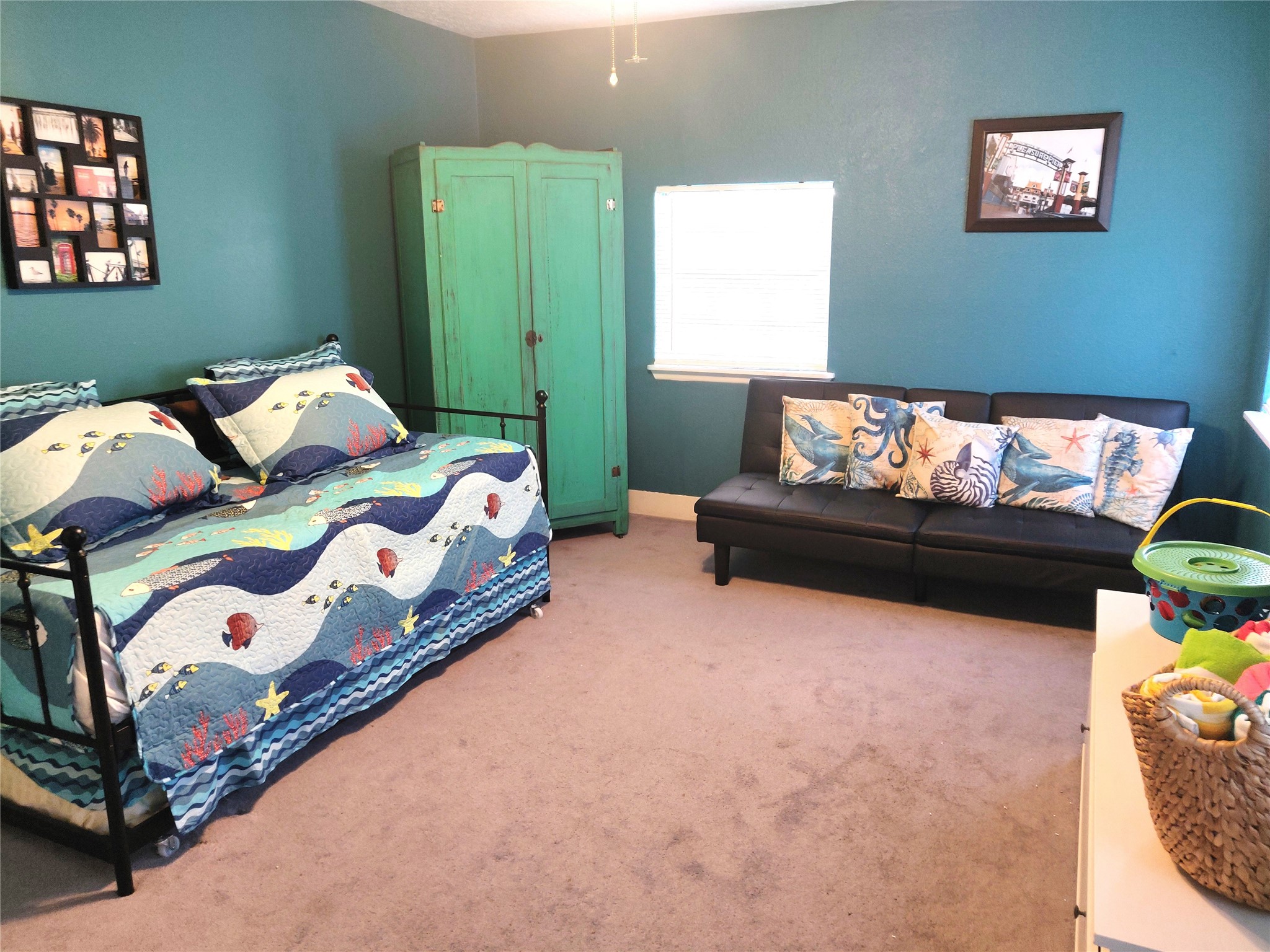 Versatile flex room, perfect for remote work, yoga, or additional sleeping space with a comfy pull-out couch and trundle bed under the day-bed
