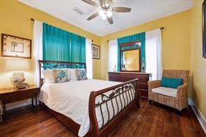 Spacious second bedroom, perfect for unwinding after a hard day at work or day in the sun, featuring a comfortable queen-size bed