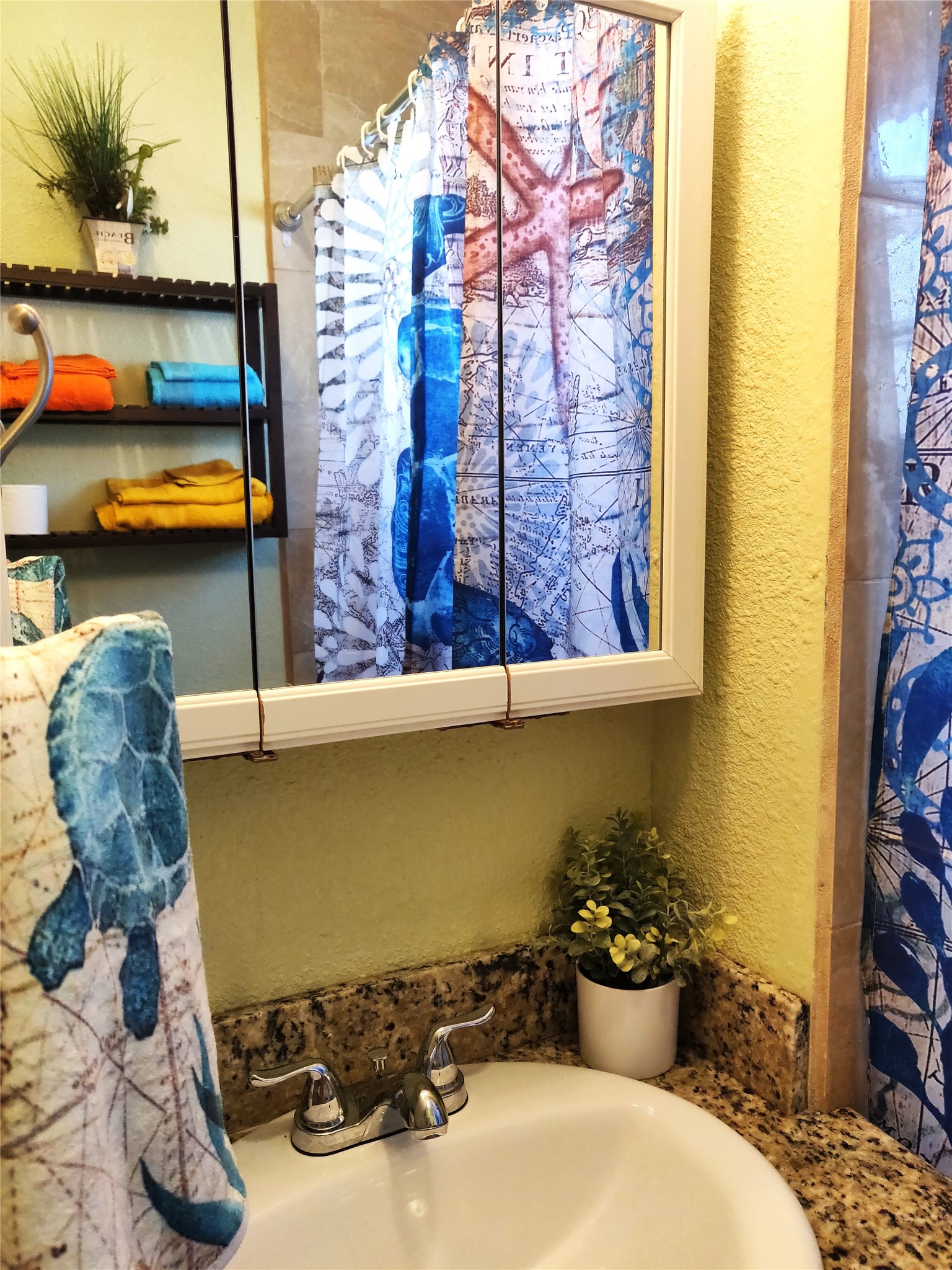 A fun, nautical bathroom that is conveniently situated between the second and third bedrooms