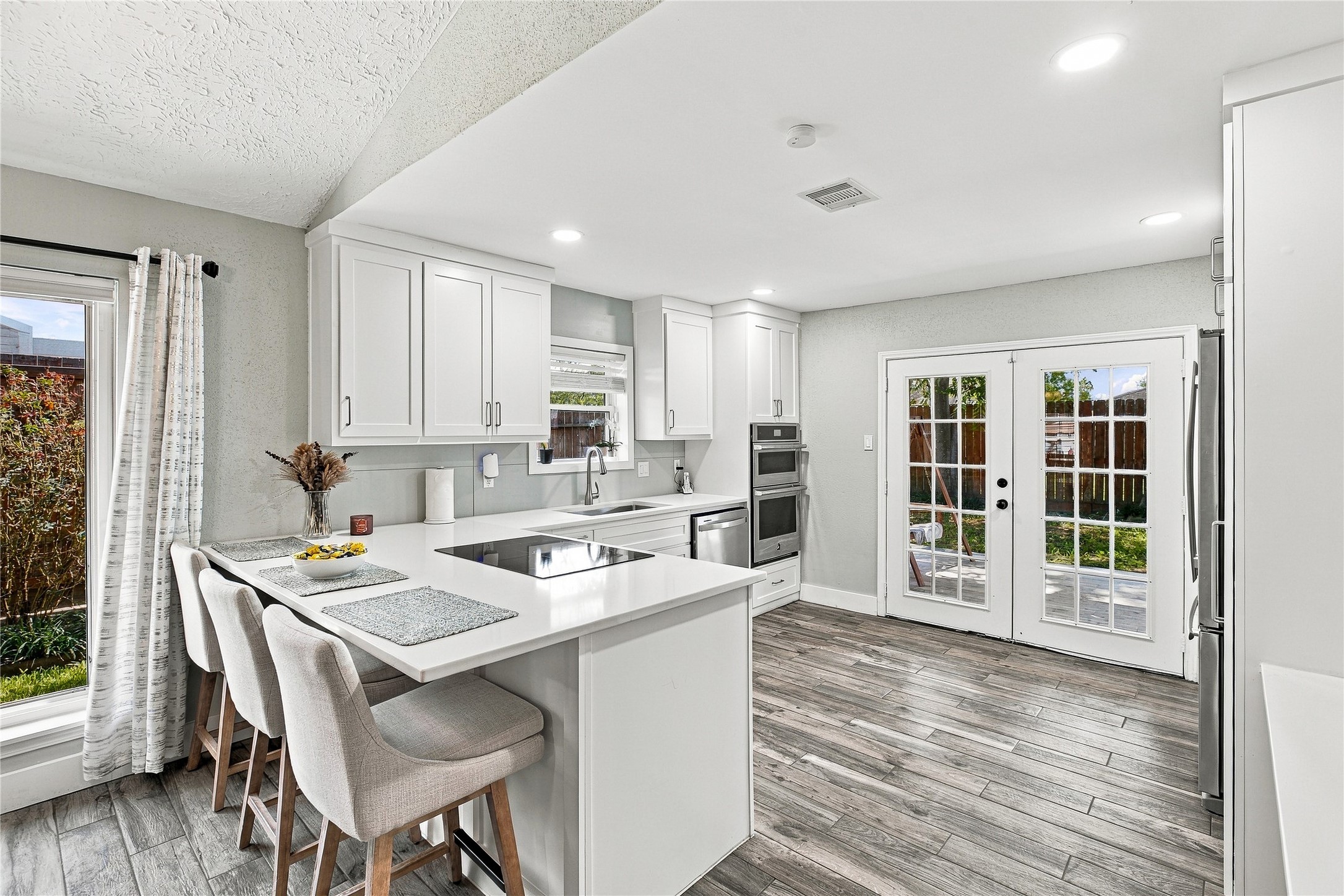 Welcome home to your beautifully remodeled chef-inspired kitchenthe heart of this charming Katy home! Featuring modern white cabinetry, expansive quartz countertops, a large island with seating, stainless steel appliances, and generous storage, this kitchen is designed for both everyday living and entertaining family and friends!