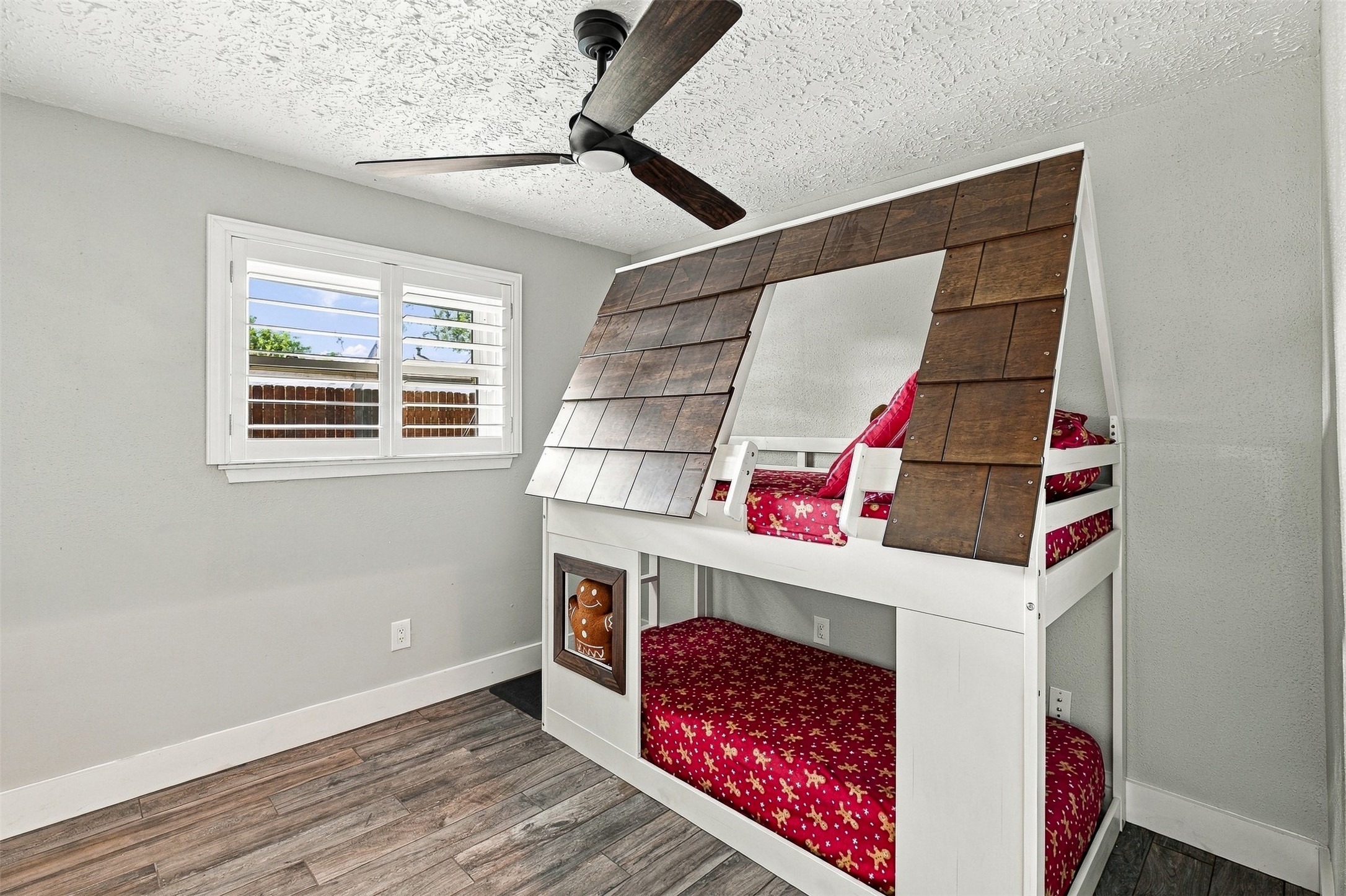 Additional secondary bedroom featuring updated flooring, ceiling fan, and neutral finishes ready to make your own.