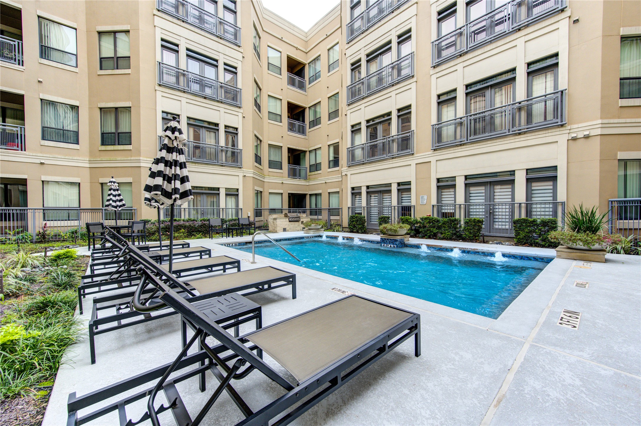 Community loungers and umbrellas, as well as outdoor grills.