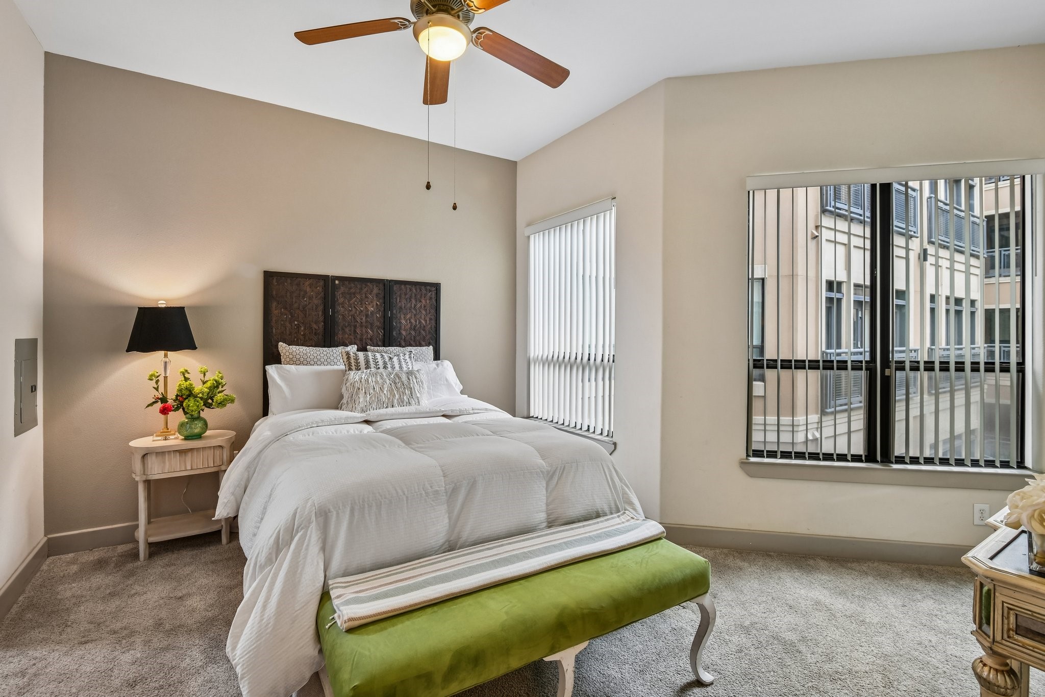 One of two bedrooms, also large windows provide natural light