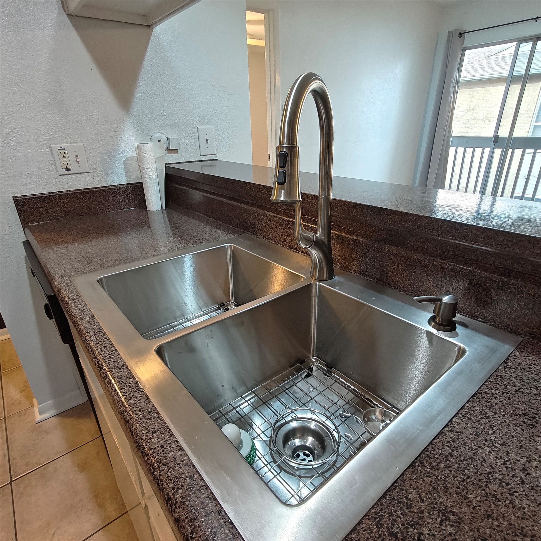 Extra large and deep sink right by the dishwasher.