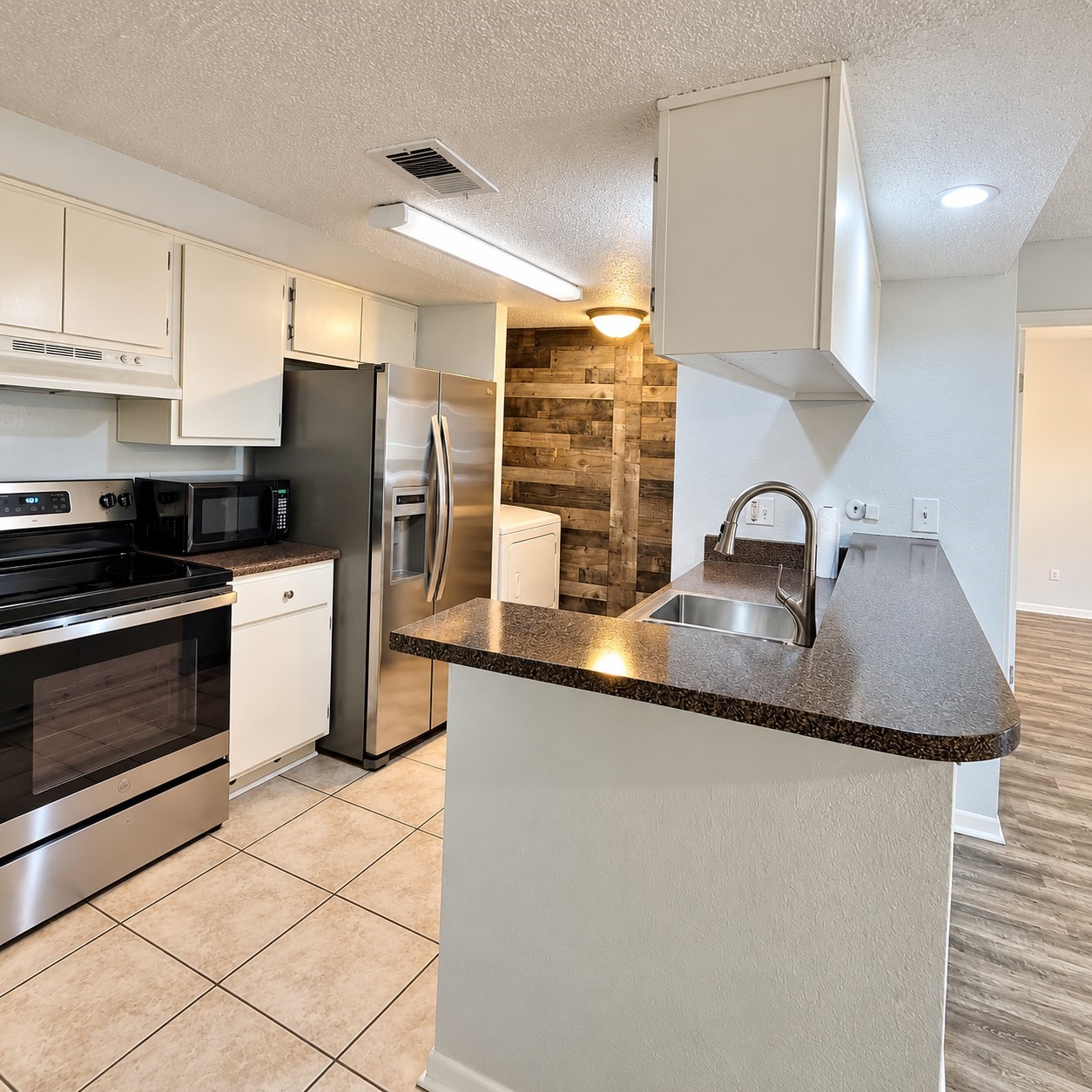 Upon entering your frontdoor you will see your beautiful kitchen to the left.