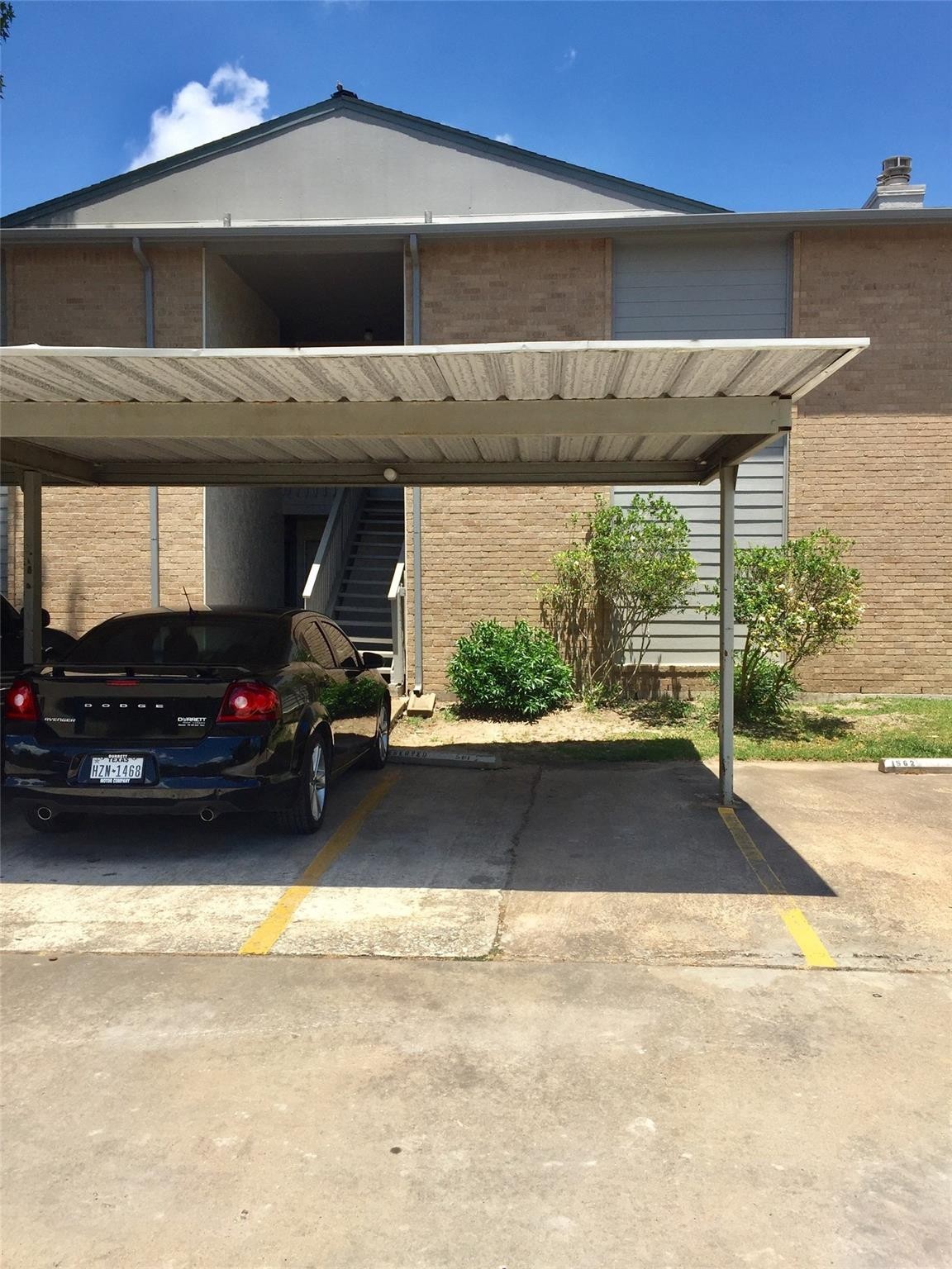 1 Covered Spot included right by the stairs toward your condo.