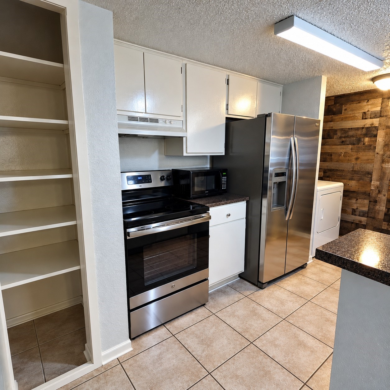 Look at the amazing stainless steel appliances and storage space.