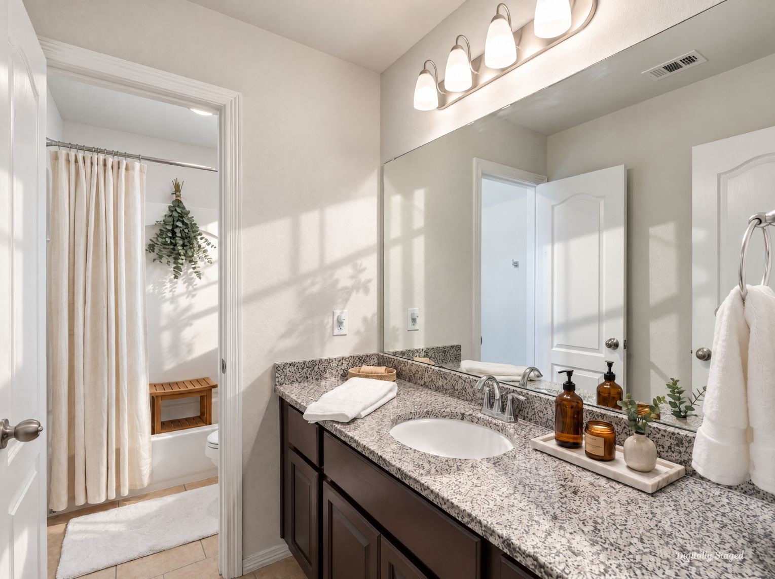 Secondary bathroom with a granite-topped vanity, dark cabinetry, and a four-light fixture over a wide mirror. A separate tub and shower area with tile flooring adds everyday convenience.
This photo has been digitally staged to illustrate the possibilities of the homes aesthetic and potential design. Some furnishings and dcor shown are for visual inspiration.