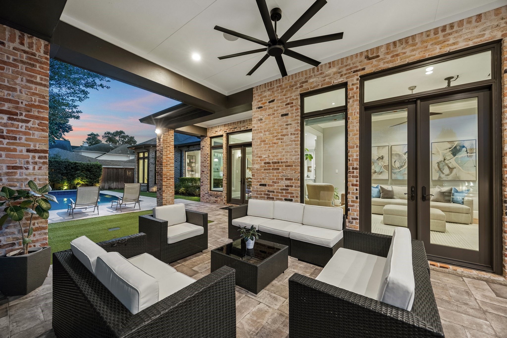 Spacious covered patio offers an inviting setting for relaxation and entertaining.