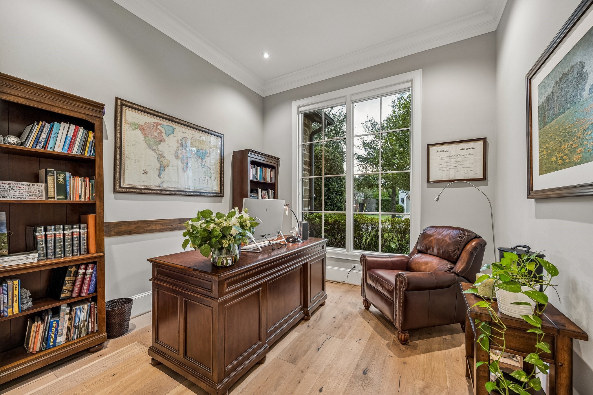 The study is located off the stunning entry foyer. This room features, LED recessed lighting, wide plank floors, crown molding and 8 Inch baseboards.  A magnificent oversized picture window with divided-light detailing provides picturesque views of the lush, beautifully landscaped grounds while allowing an abundance of natural light to illuminate the room.