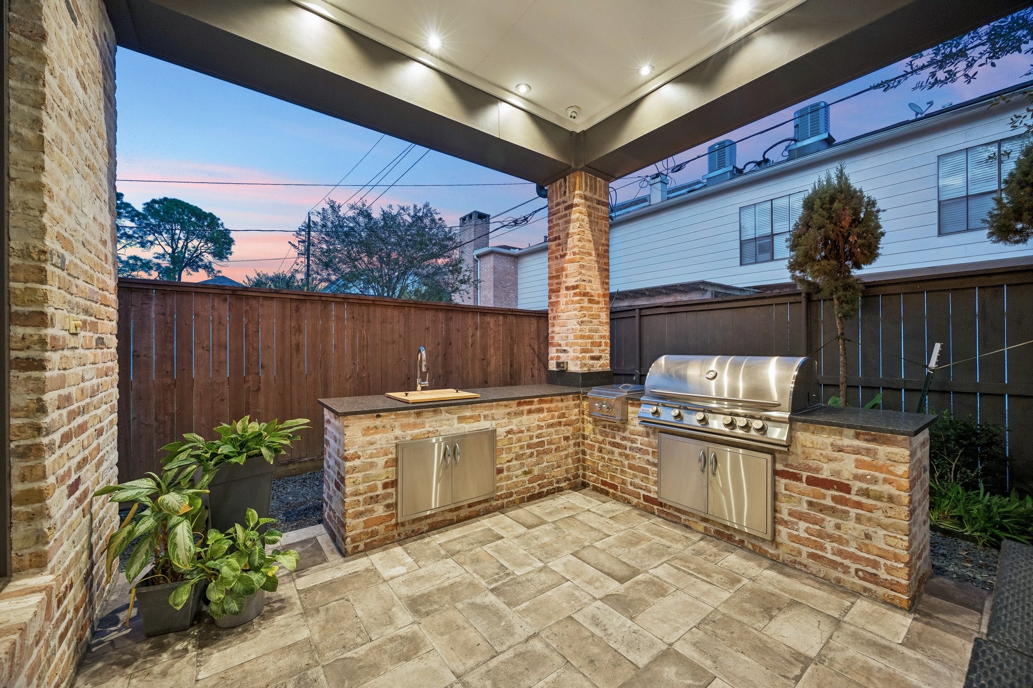 The outdoor kitchen is thoughtfully designed as an extension of the home's living spaces.  This inviting retreat provides the perfect setting for alfresco dining, casual gatherings, and year-round entertaining.