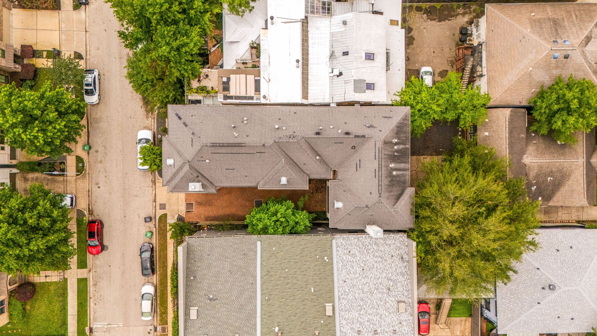 This aerial photo shows the mature trees near W Bell St and helps one envision life on this quiet street.