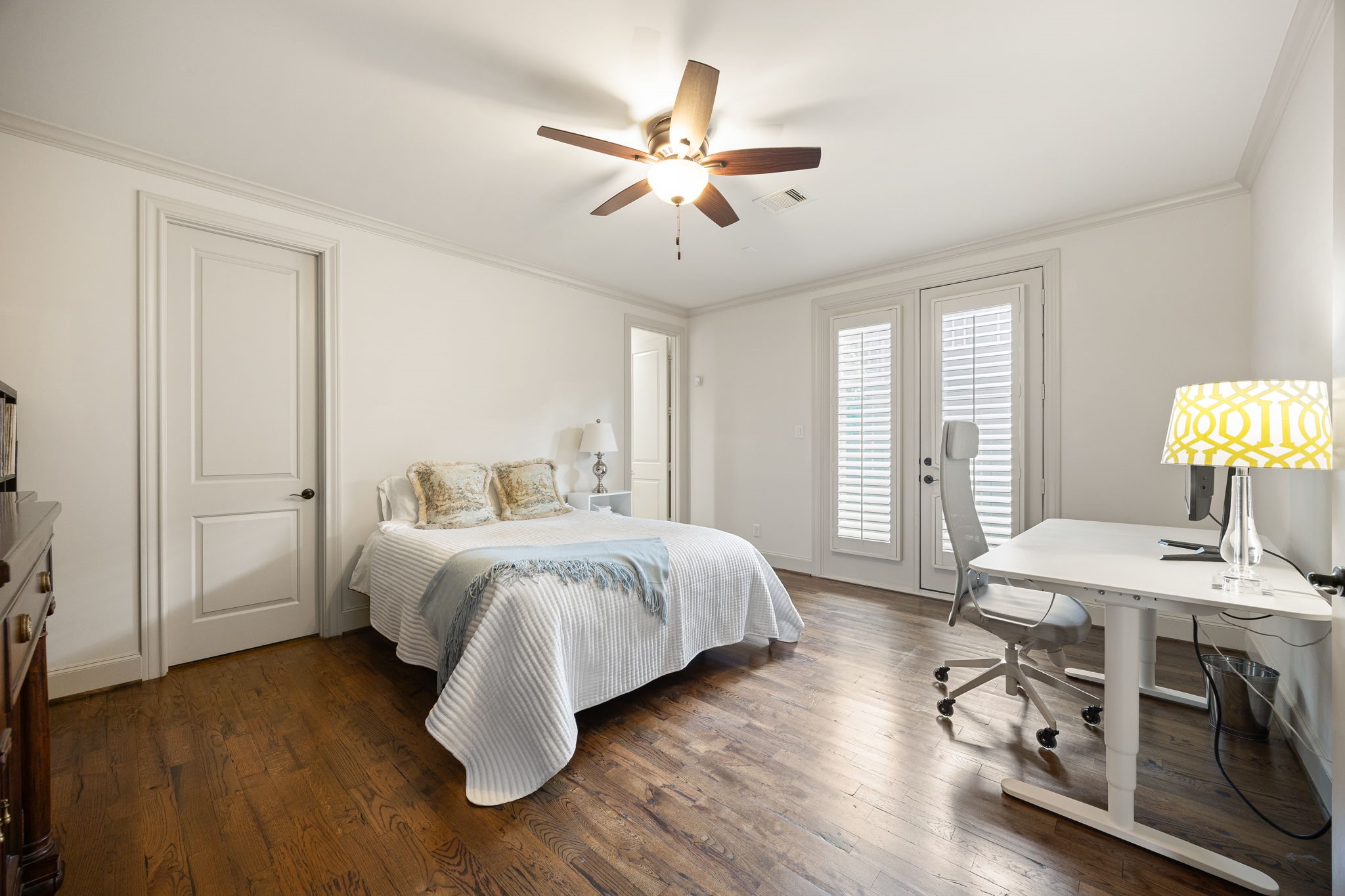 The first floor secondary bedroom is fully equipped with its private full bathroom.  This room is spacious and draws ample natural light. It could be outfitted as a home office as well.
