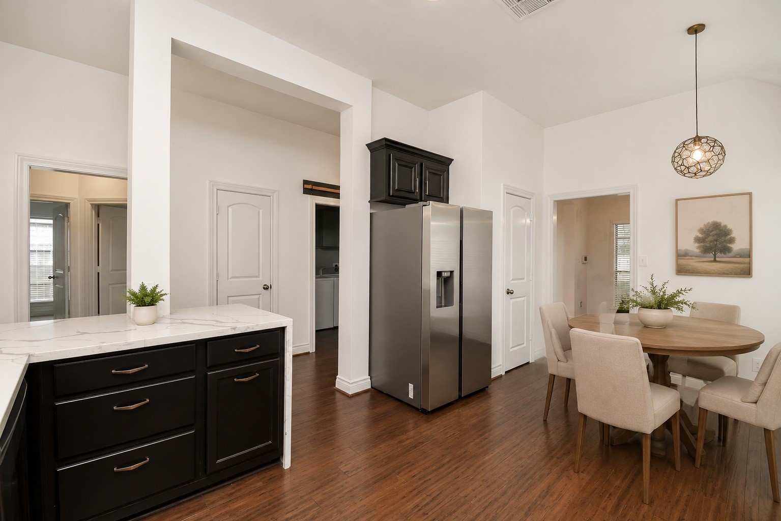 The bright breakfast area is perfectly positioned just off the kitchen, offering an inviting space for casual dining, morning coffee, or family meals. The open layout creates a seamless connection to the kitchen and family room, making everyday living both comfortable and convenient. Virtually staged!