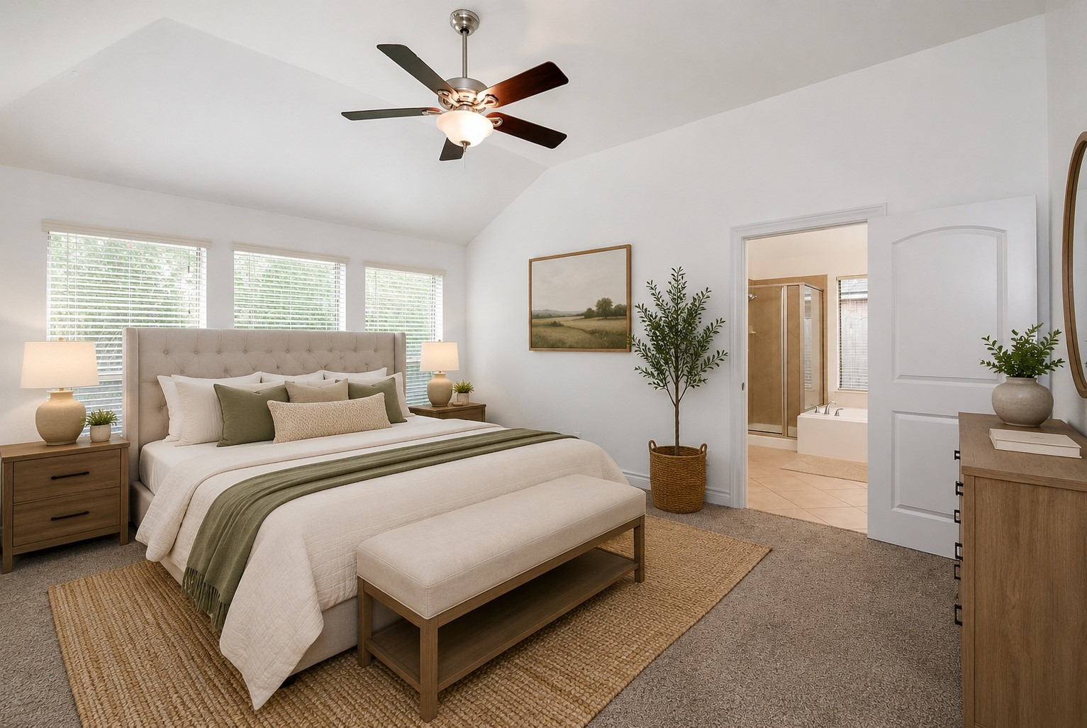 Retreat to a spacious and serene primary suite featuring soaring ceilings, abundant natural light, and plenty of room for a king-size furniture arrangement. The private owner's retreat seamlessly connects to the spa-inspired en-suite bath, complete with a soaking tub, separate glass-enclosed shower, dual vanities, and a generous walk-in closet. A peaceful space designed for comfort, relaxation, and everyday luxury. Virtually Staged.