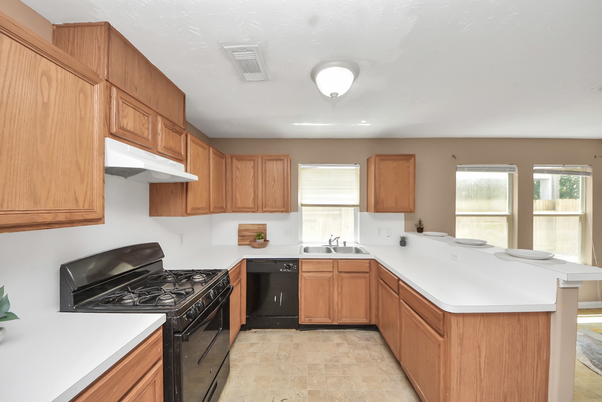 The kitchen offers a good amount of counter space and storage, plus a convenient pantry located just behind this view.