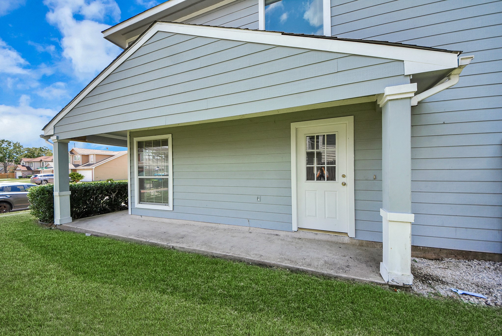 The front door is conveniently located on the side of the home, providing additional privacy.