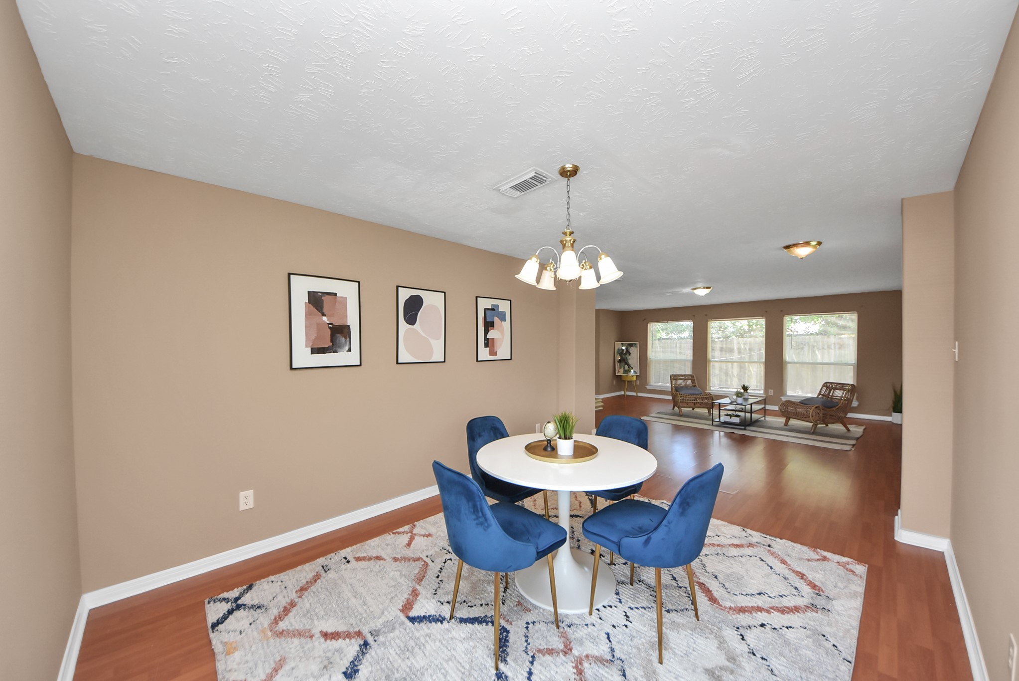 From this opposite angle, you can get a better view of the floor plan as you enter the home. The formal dining room is on the other side, while an additional wall of windows brings even more natural light into the living area. From this opposite angle, you can get a better view of the floor plan as you enter the home. The formal dining room is on the other side, while an additional wall of windows brings even more natural light into the living area.