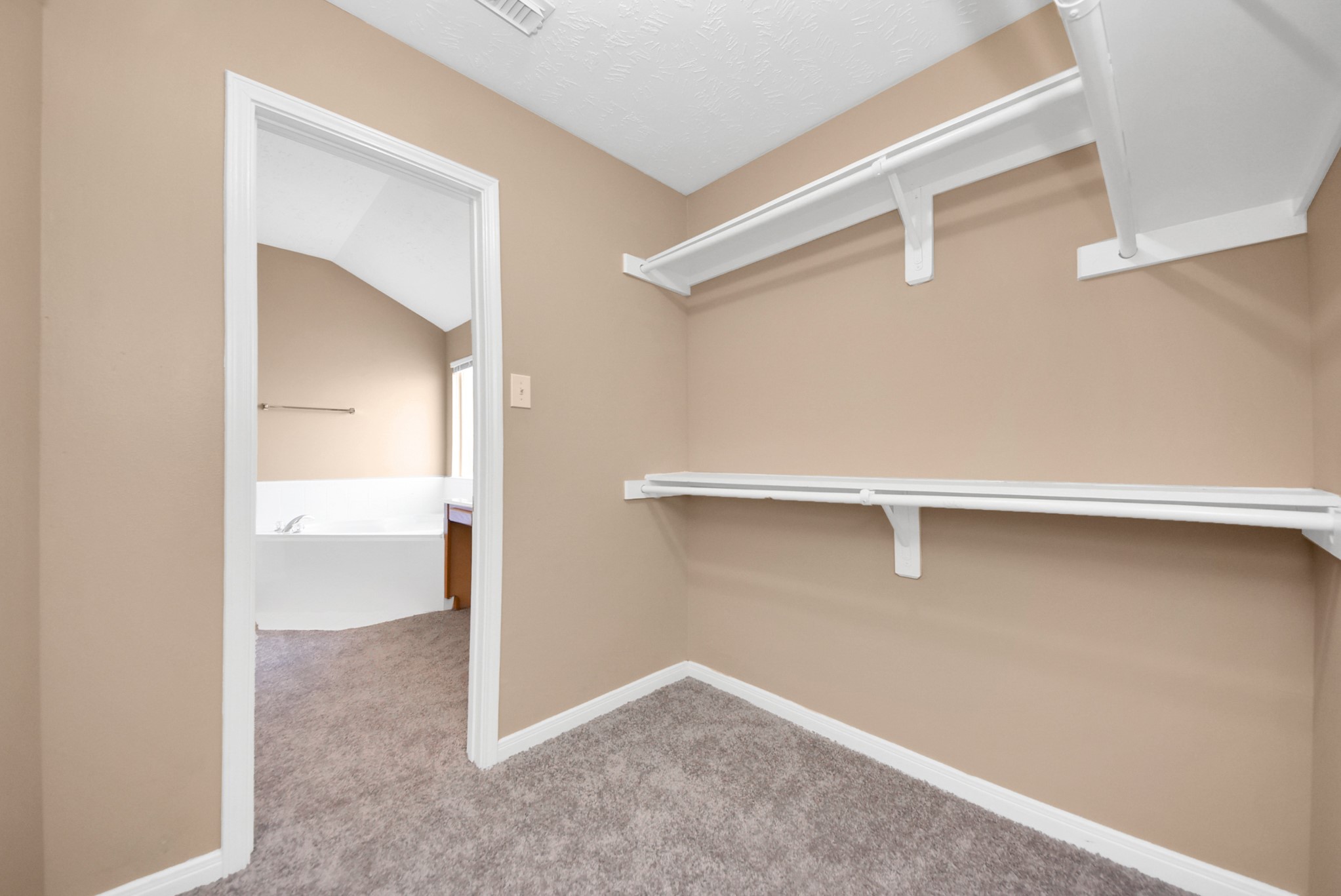 One more view of the walking closet looking into the bathroom.