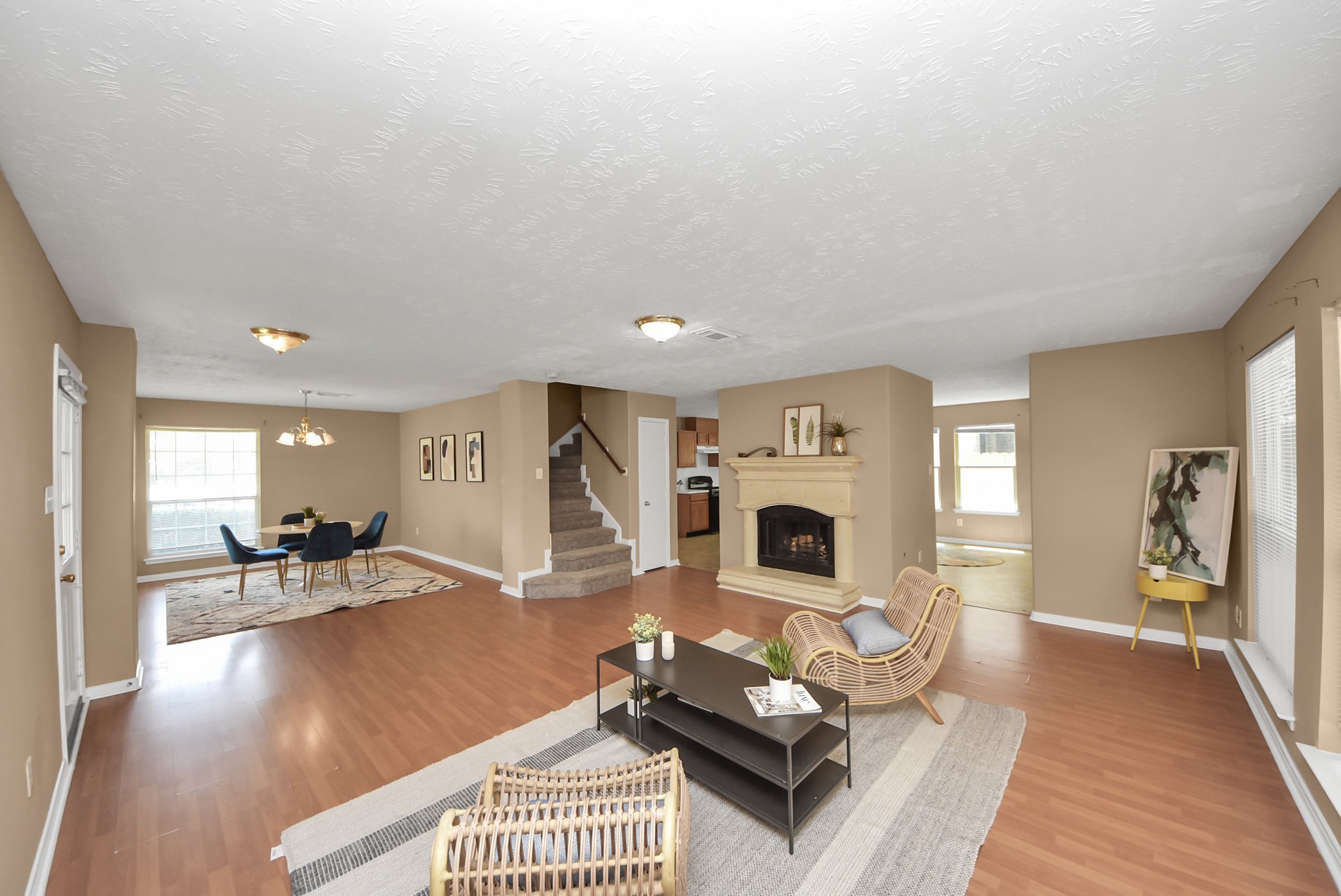 From this angle, you get a better view of the kitchen and the staircase leading to the second floor. The recently painted interior walls give the home a fresh and clean look. From this angle, you get a better view of the kitchen and the staircase leading to the second floor. The recently painted interior walls give the home a fresh and clean look.