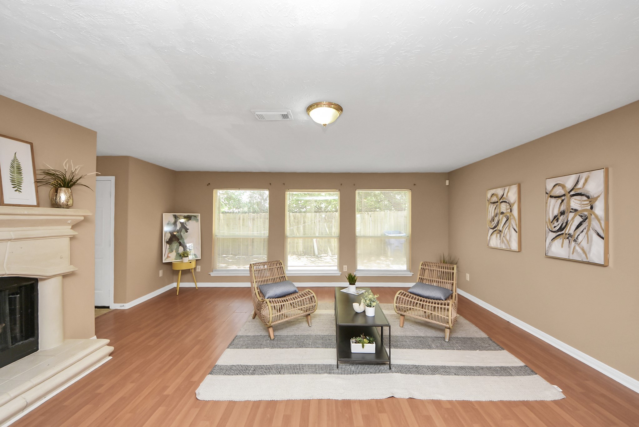 A cozy fireplace adds character to the living room while creating a natural separation from the kitchen and breakfast area. A cozy fireplace adds character to the living room while creating a natural separation from the kitchen and breakfast area.