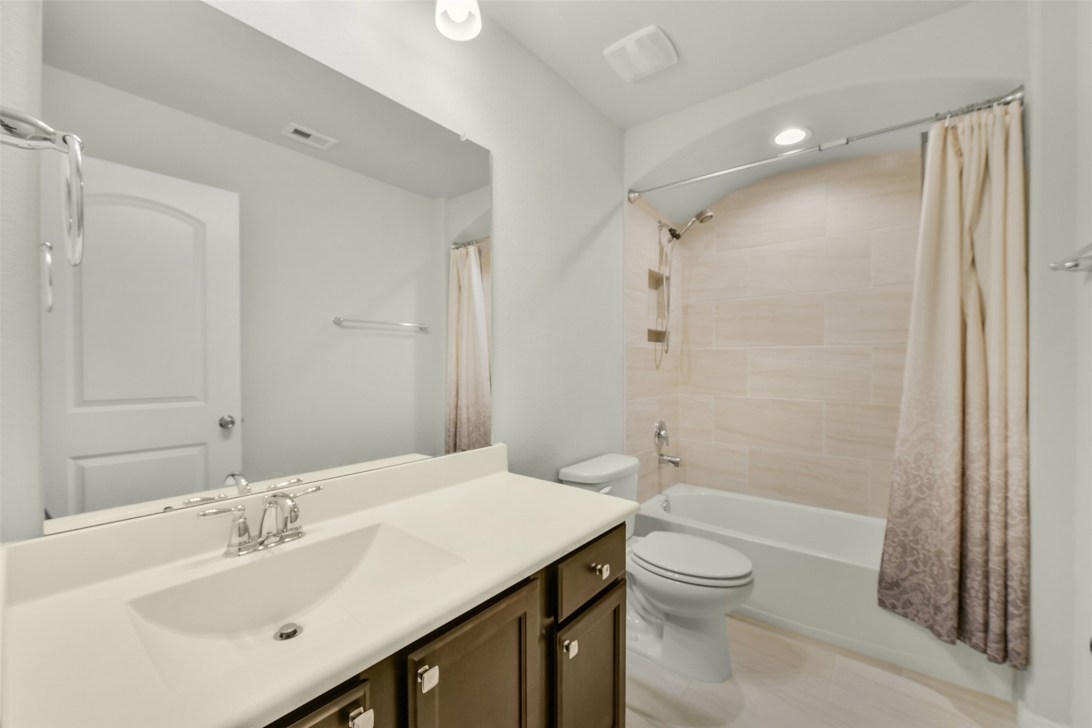 Third full bath located upstairs next to 4th bedroom