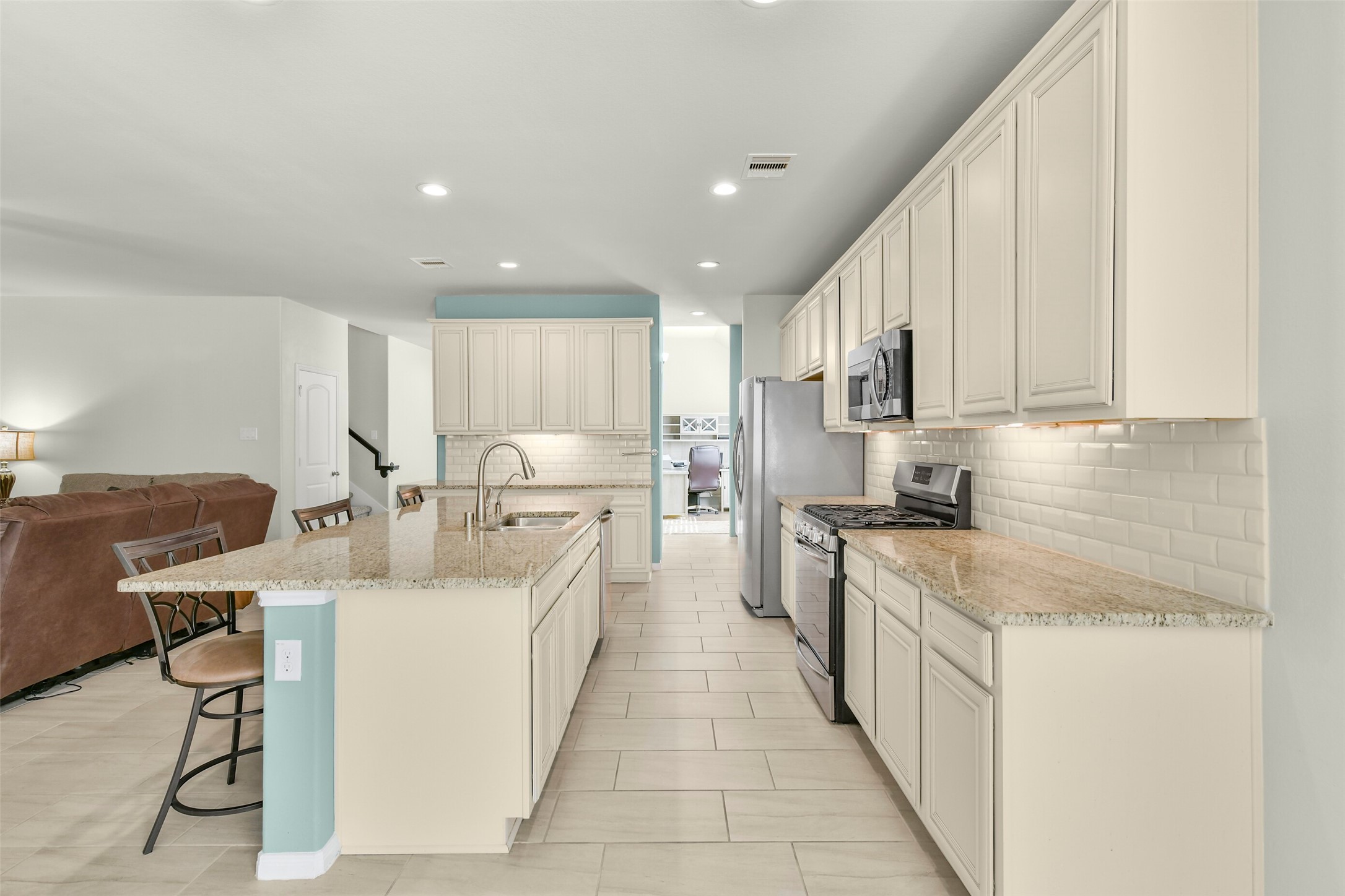Abundant storage and cabinet space; beautiful subway tile back splash; wonderfully colored granite; You will love this kitchen!