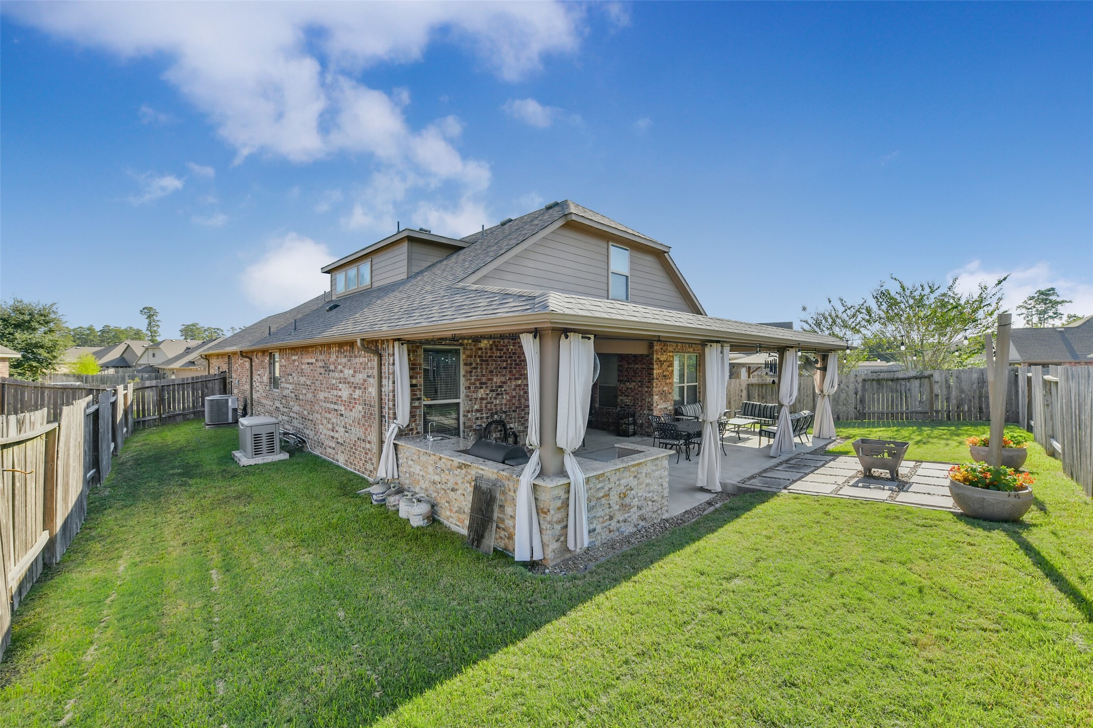 A whole house generator, large built in outdoor kitchen and a patio you will never wanna leave