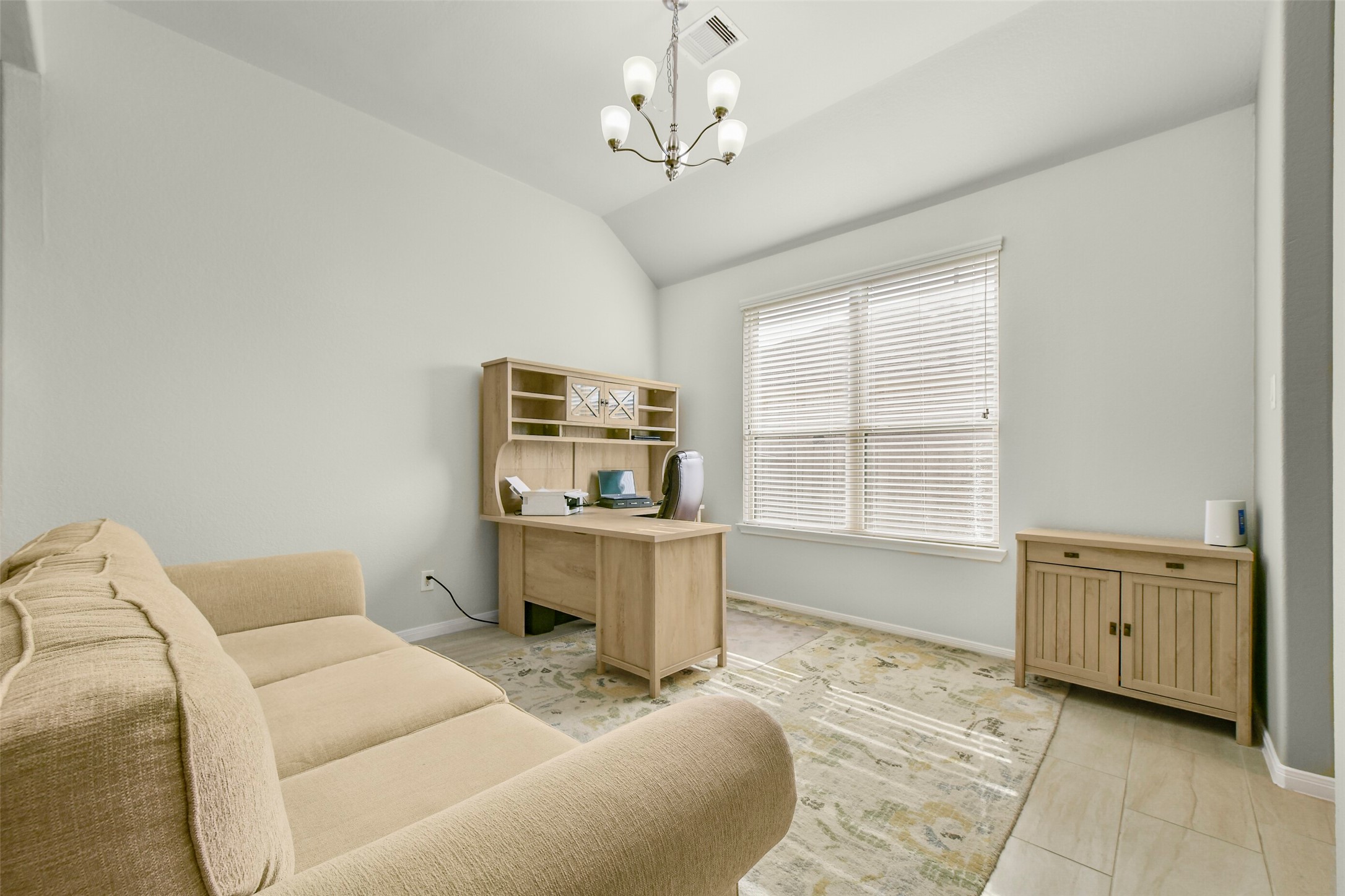 Additional dining area currently being used as a study with tile floors, blinds, high ceilings & excellent lighting with pass-thru to the butler's pantry