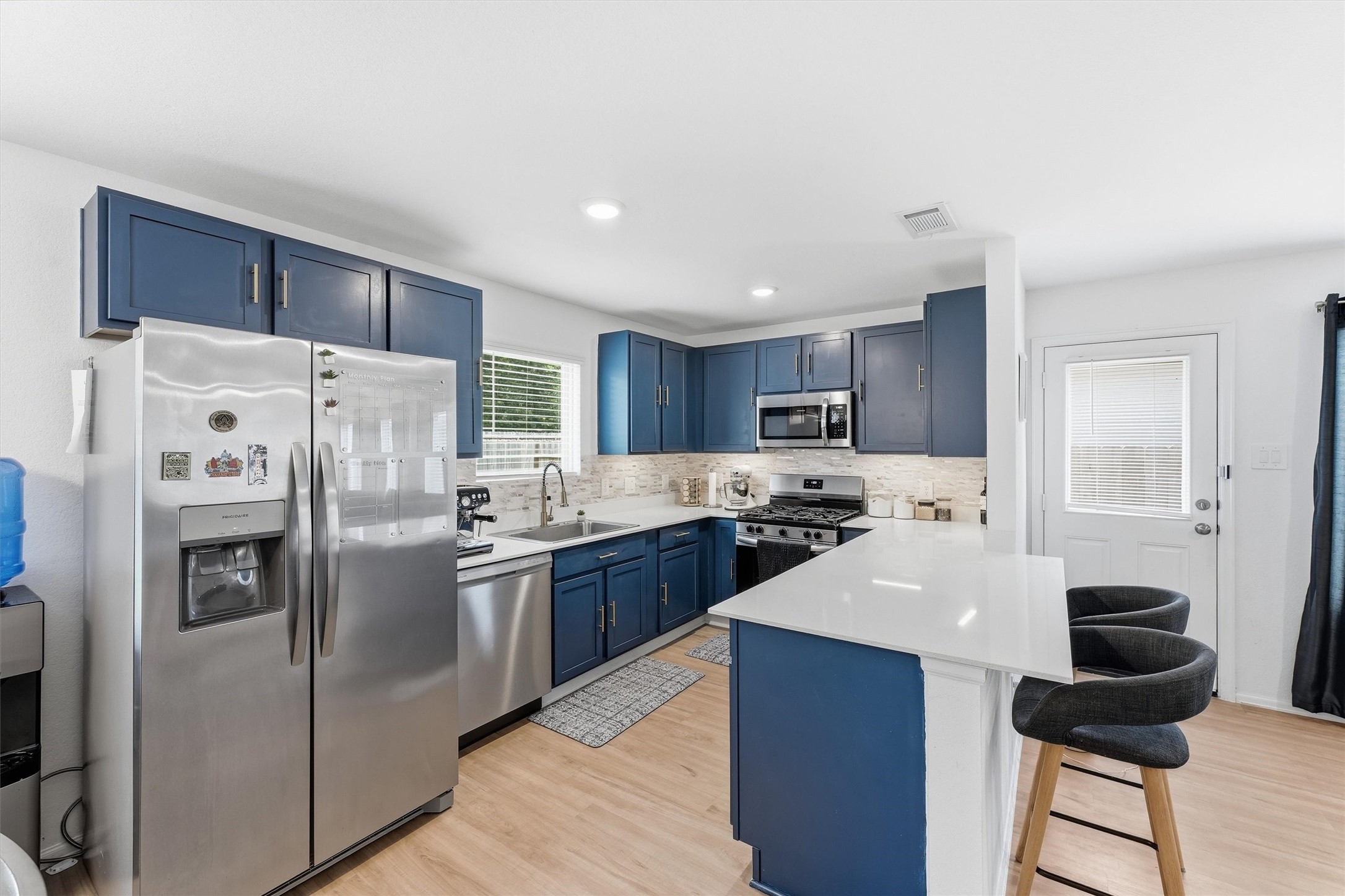 Kitchen opens to the living room. Great for entertaining.
