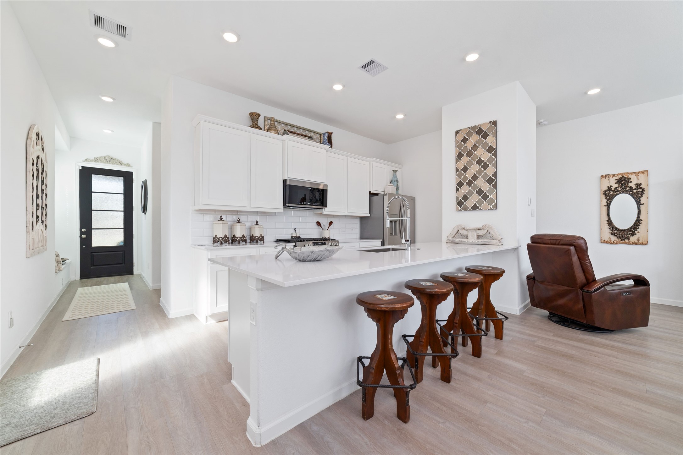 The open-concept main floor seamlessly connects the kitchen, dining, and family room, creating an ideal layout for everyday living and entertaining.
