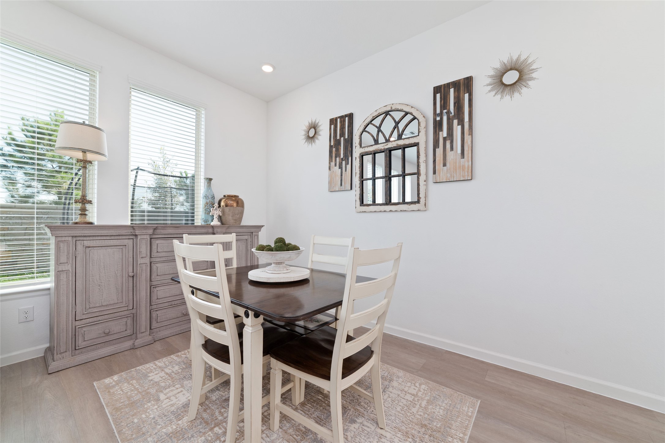 The dining area offers ample room for a dining table, with beautiful natural light and convenient access to the kitchen for effortless entertaining.