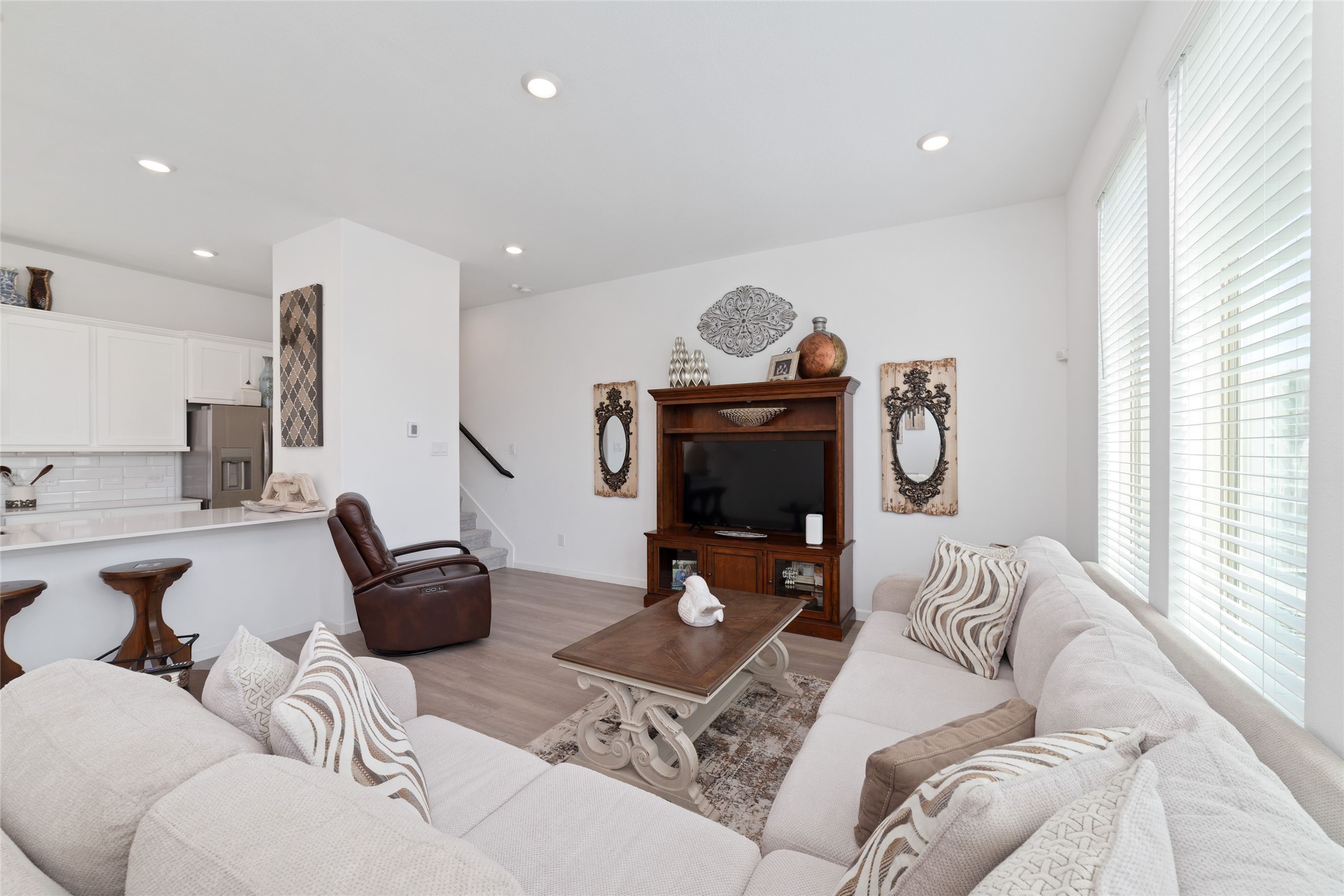 Another perspective of the family room showcases its generous dimensions, comfortable seating possibilities, and bright, airy atmosphere.