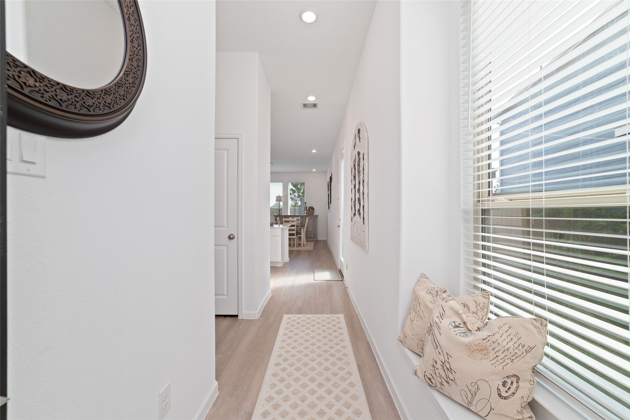 Step inside to a bright, inviting entryway featuring neutral finishes, natural light, and a welcoming atmosphere that flows into the main living areas.