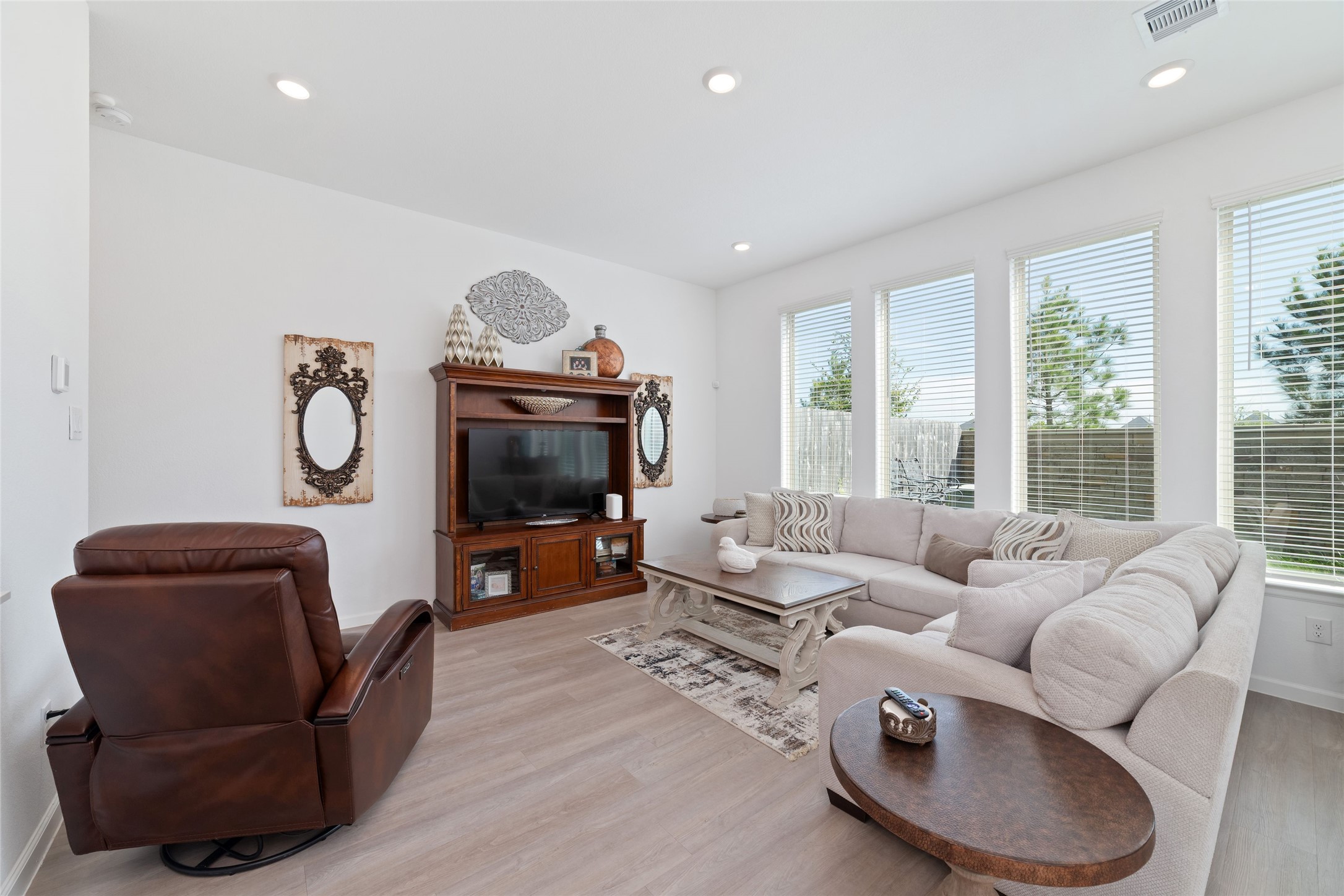 The inviting living area provides plenty of space for your favorite furnishings, with abundant natural light and a seamless connection to the dining area.