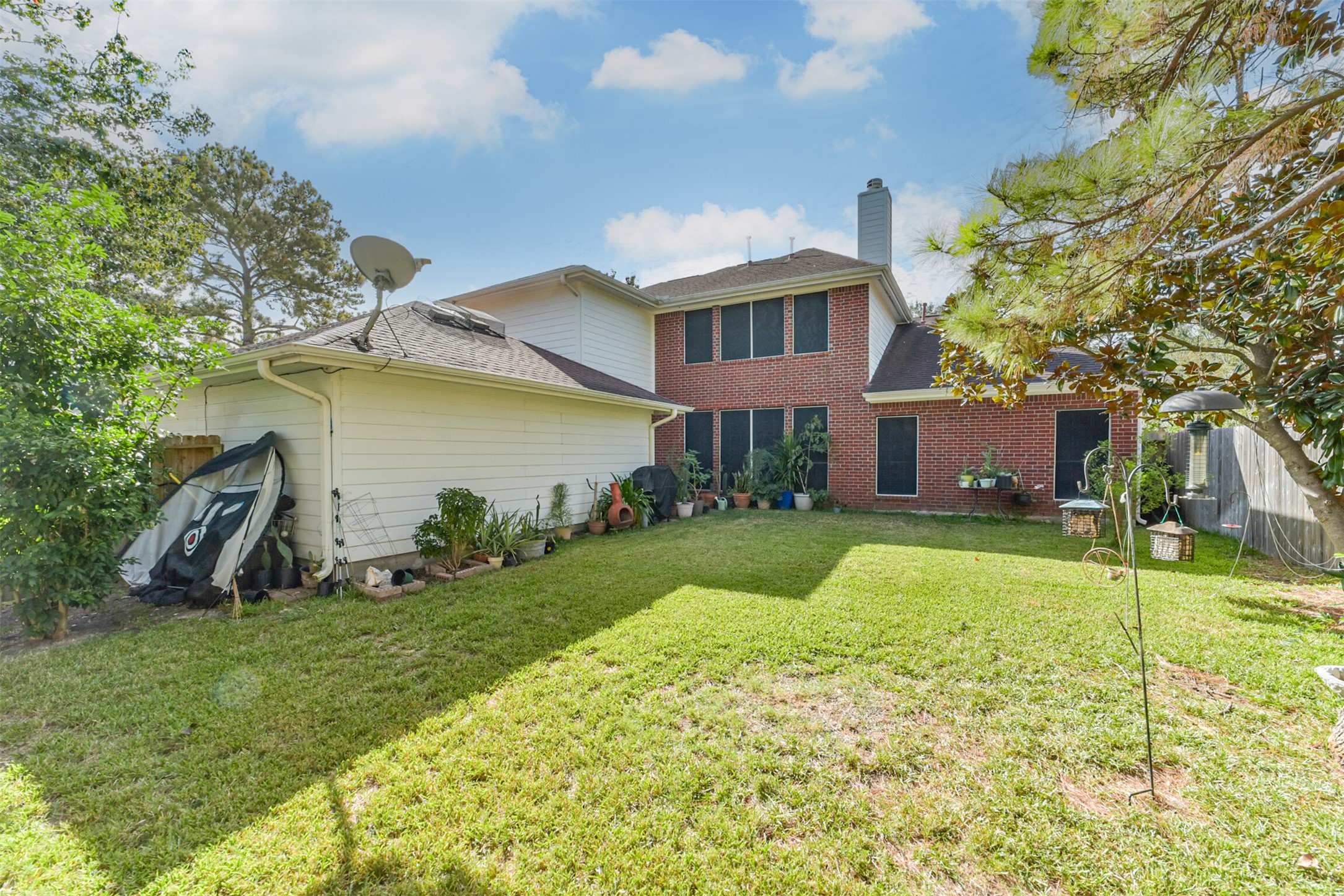 The home is built with brick on all four sides, and the back is fitted with a solar screen.