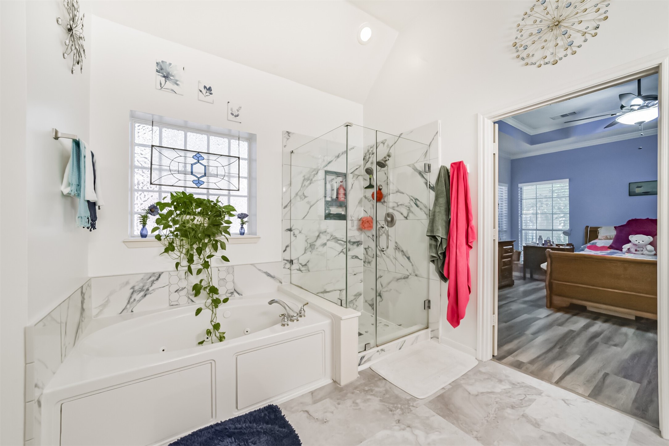 Unwind in your jetted soaker tub, with soft, diffused light streaming through the window.