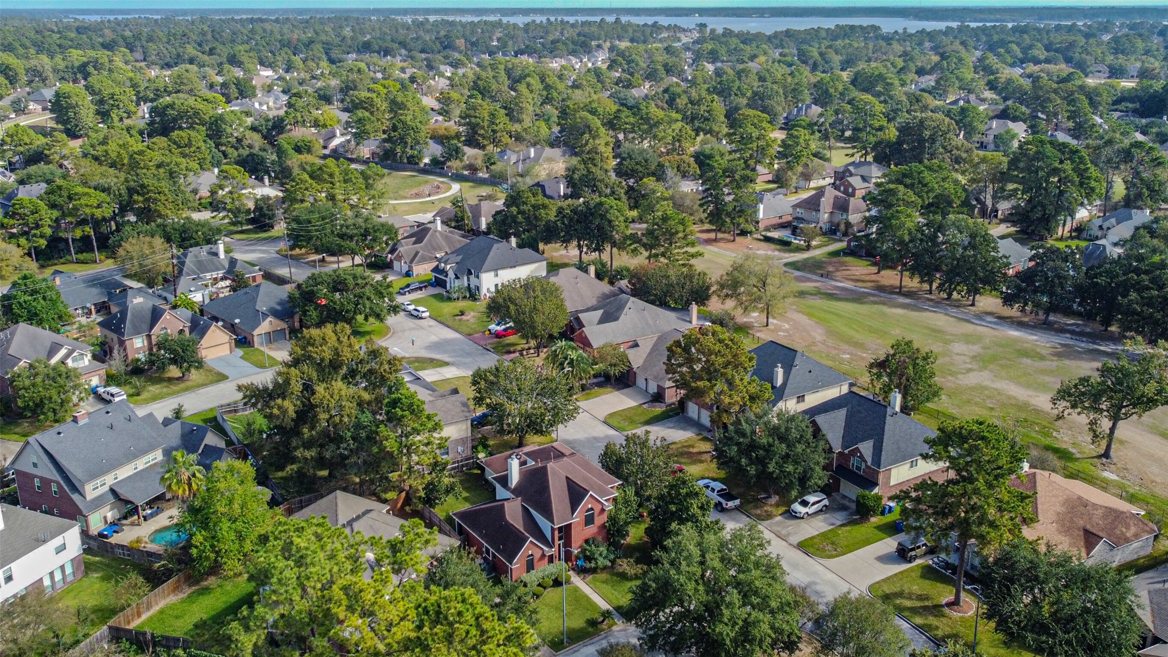 Aerial view of the home, with Lake Houston in the background.