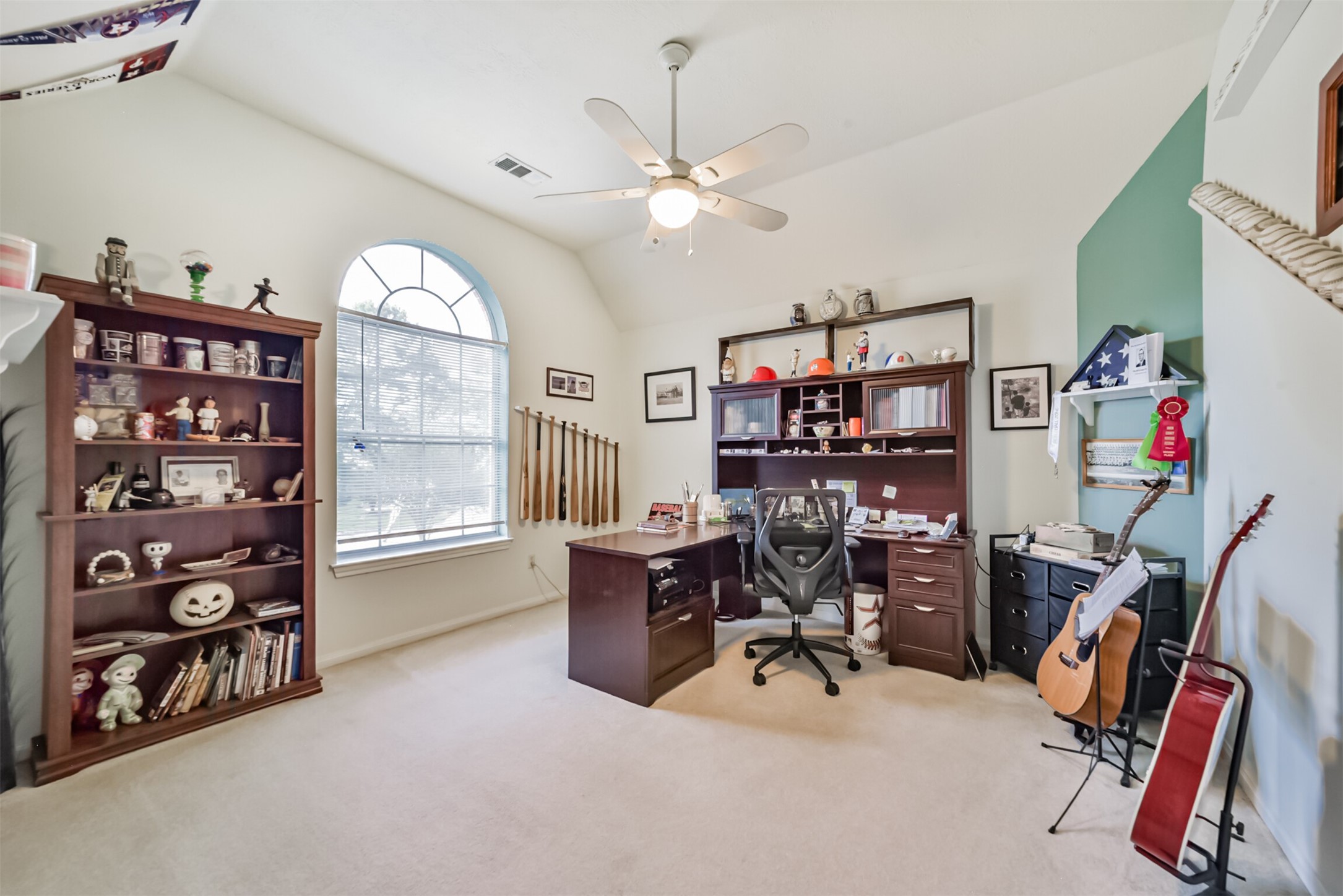 Upstairs, the fourth bedroom doubles as a home office and entertainment space.