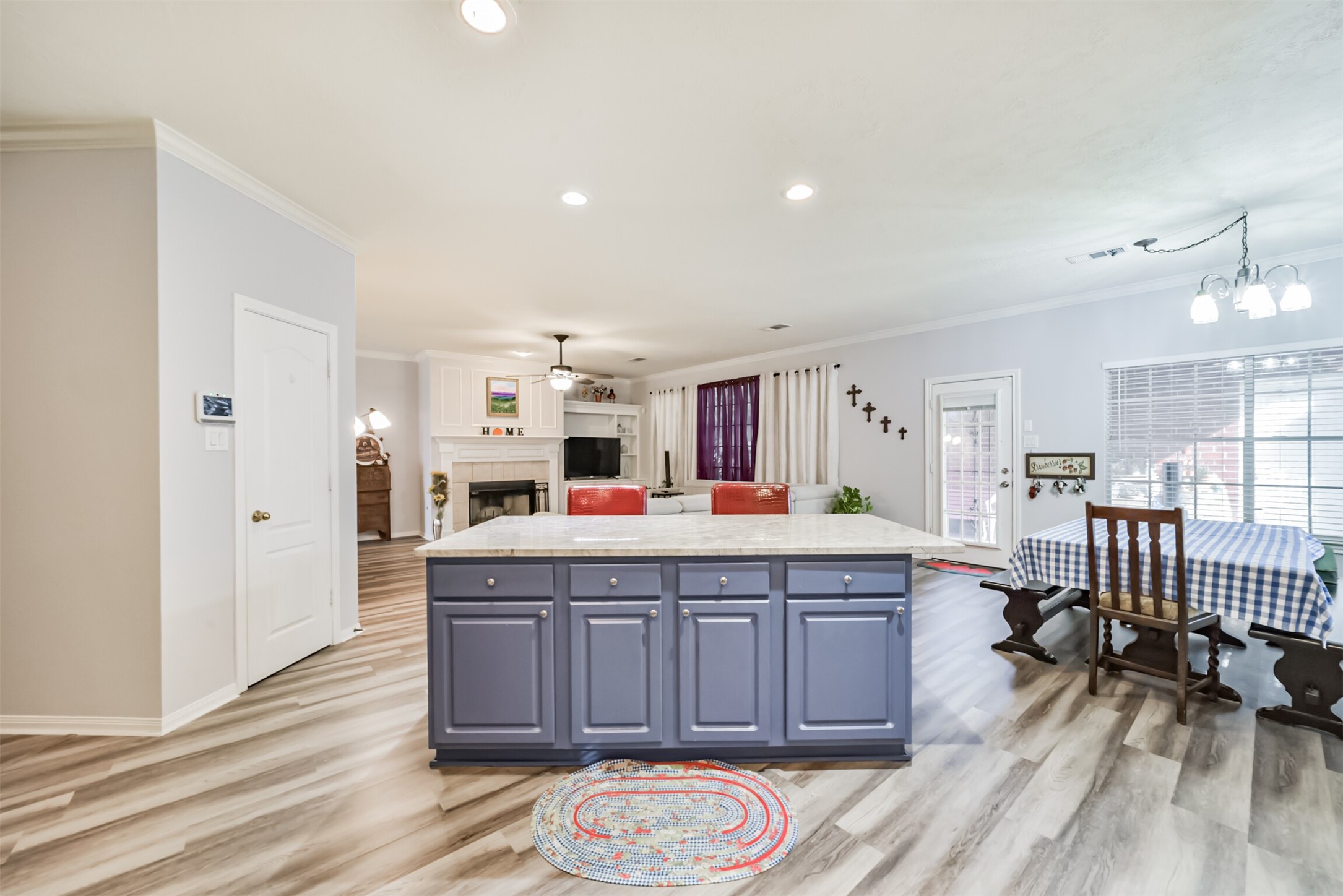 A center island with built-in drawers and cabinets provides additional storage space.