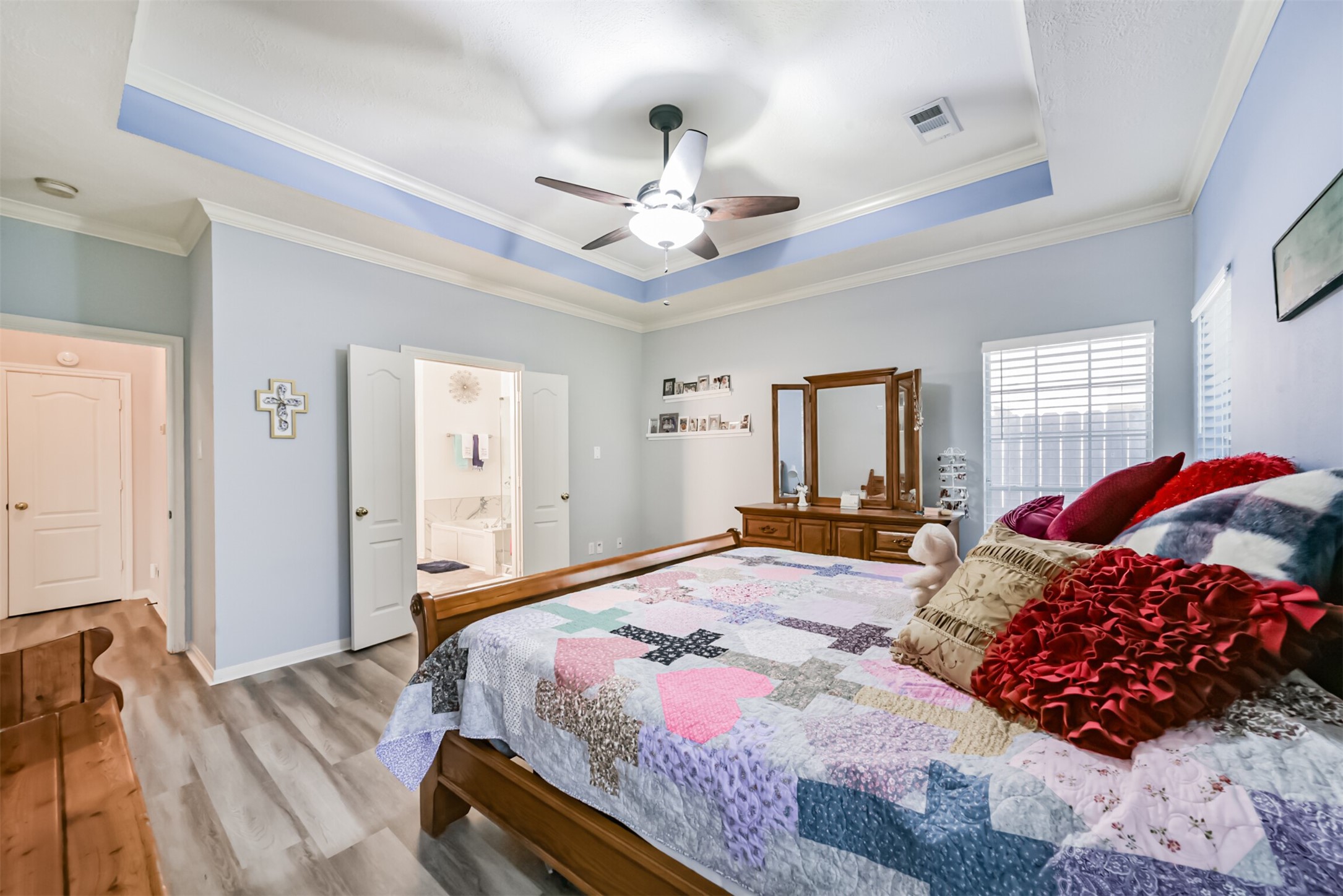 Primary bedroom with direct access to the en-suite bathroom