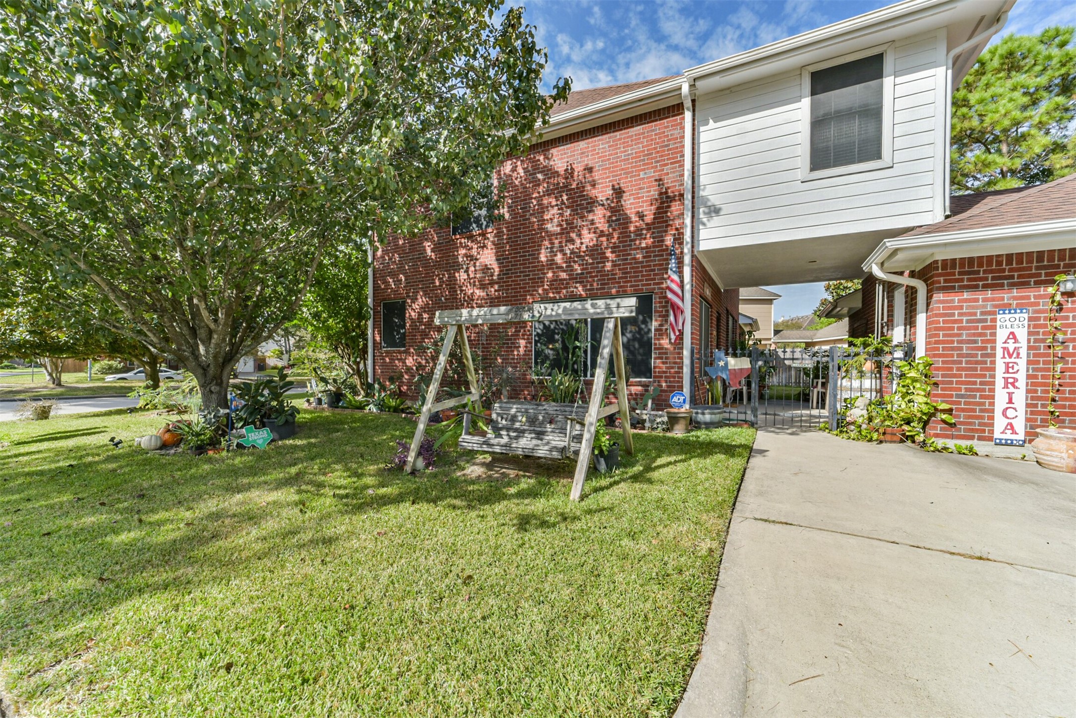 The home extends to the garage, creating a spacious covered breezeway.