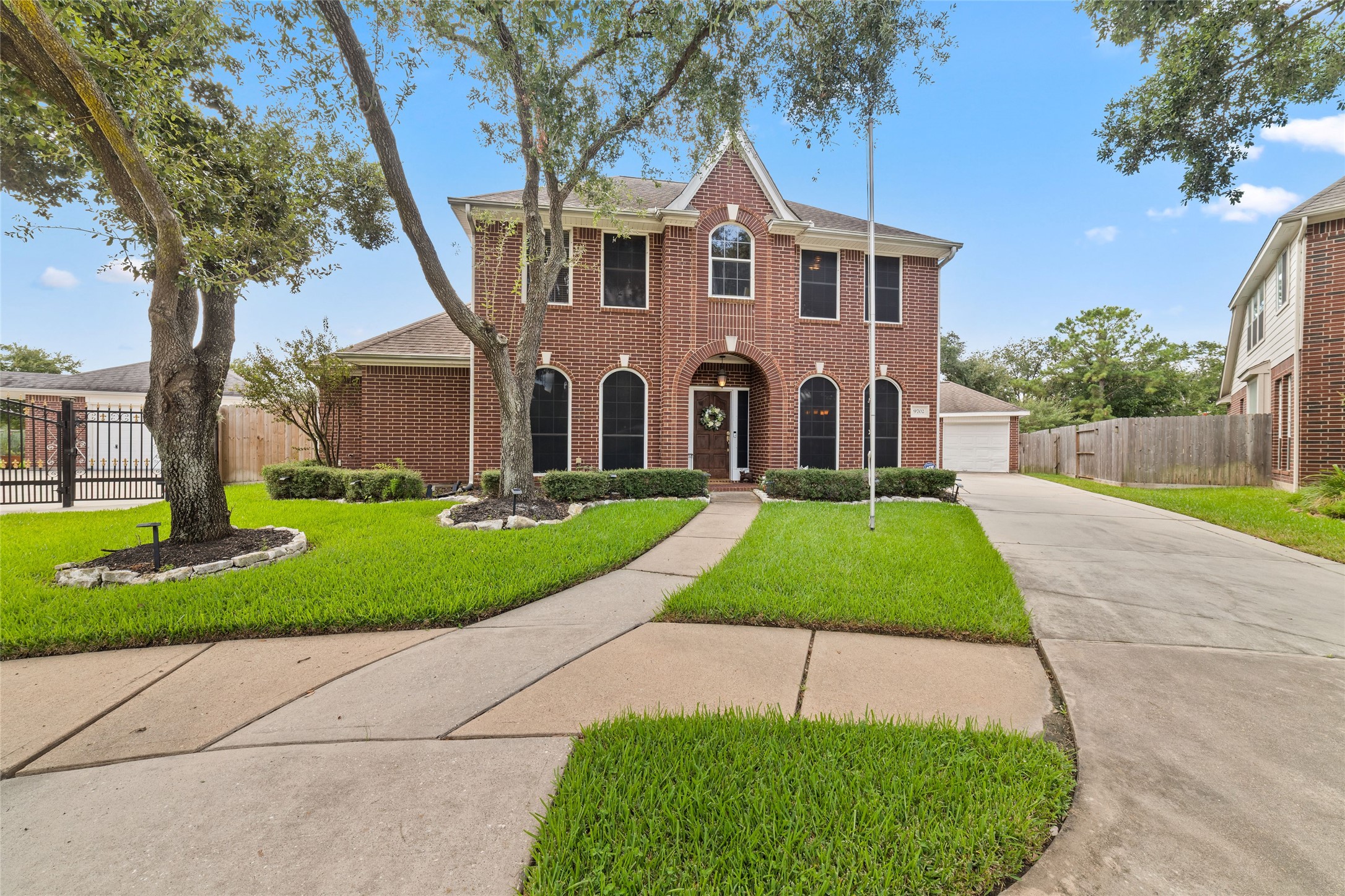Welcome to 9702 Raymont Circle, where classic curb appeal, mature shade trees, and an oversized cul-de-sac lot create an impressive first look before you even step inside.