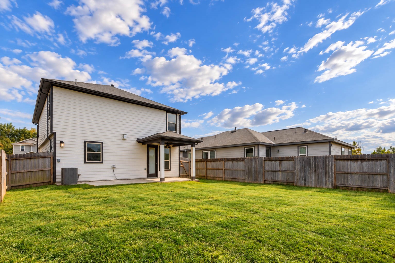 Enjoy the possibilities of this wonderful backyard retreat! The covered patio provides a comfortable spot for outdoor seating, while the expansive lawn offers plenty of room for recreation.