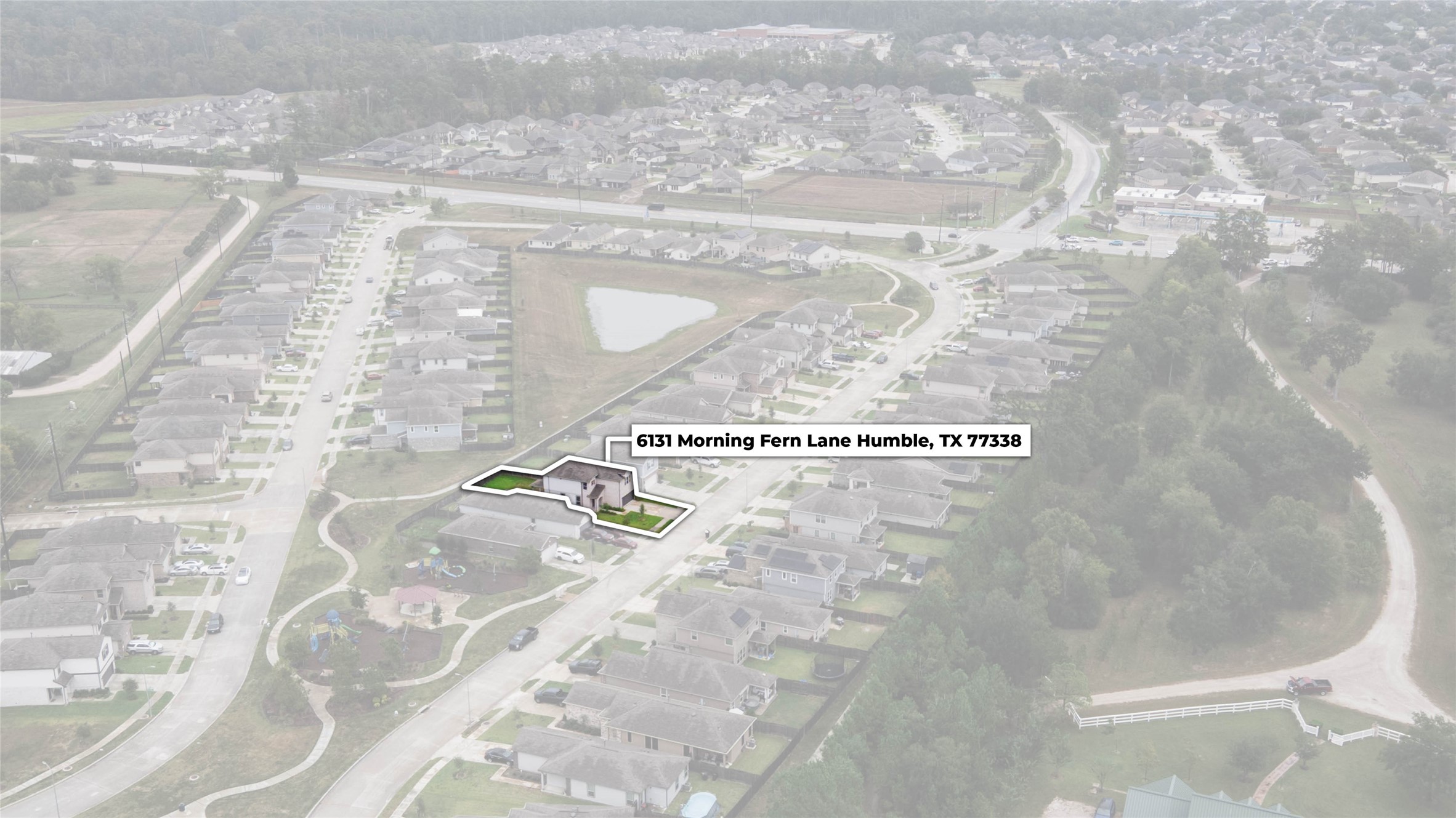 This impressive aerial view showcases the home's desirable location at 6131 Morning Fern Lane, nestled within Flagstone!
