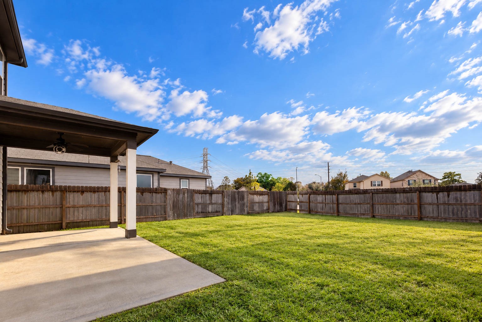 Imagine relaxing beneath the covered patio while overlooking the spacious, fully fenced backyard! Complete with a ceiling fan & an extended concrete pad, this patio offers a wonderful setting for morning coffee, weekend barbecues, or simply enjoying the outdoors.