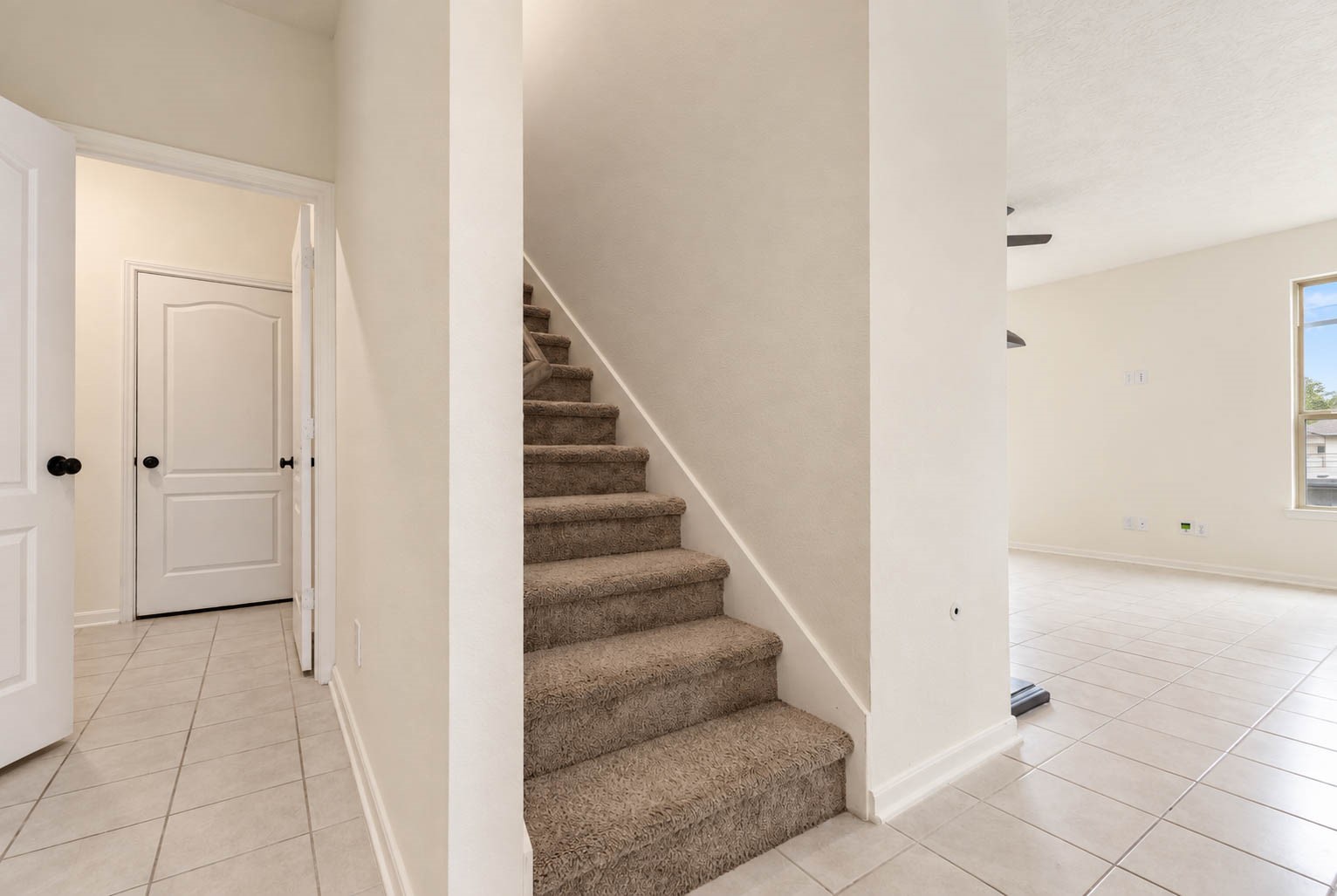 A conveniently located staircase leads to the spacious second floor, where a generous game room & comfortable bedrooms offer versatile spaces for entertainment, privacy, & relaxation.