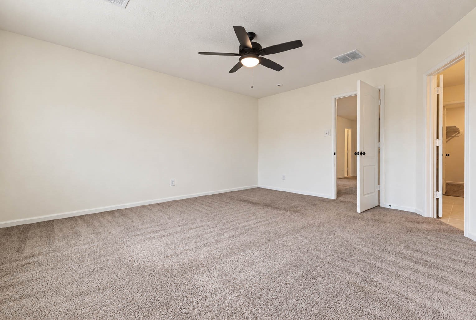 The generously sized layout offers plenty of room for a luxurious bedroom arrangement, along with additional space for a cozy sitting area or private reading nook, creating the perfect place to unwind at the end of the day.