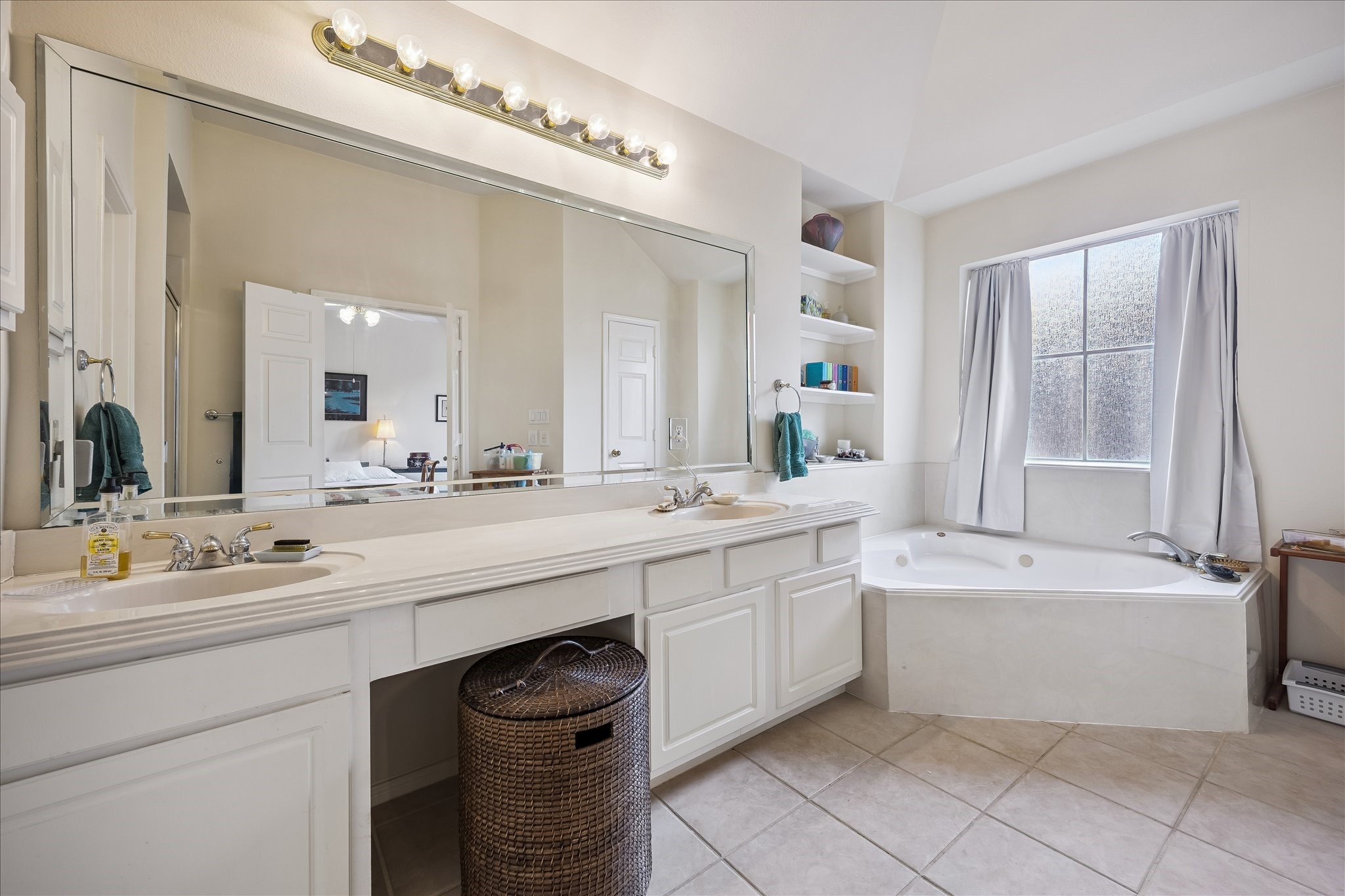 Primary Bathroom has a jetted spa tub.